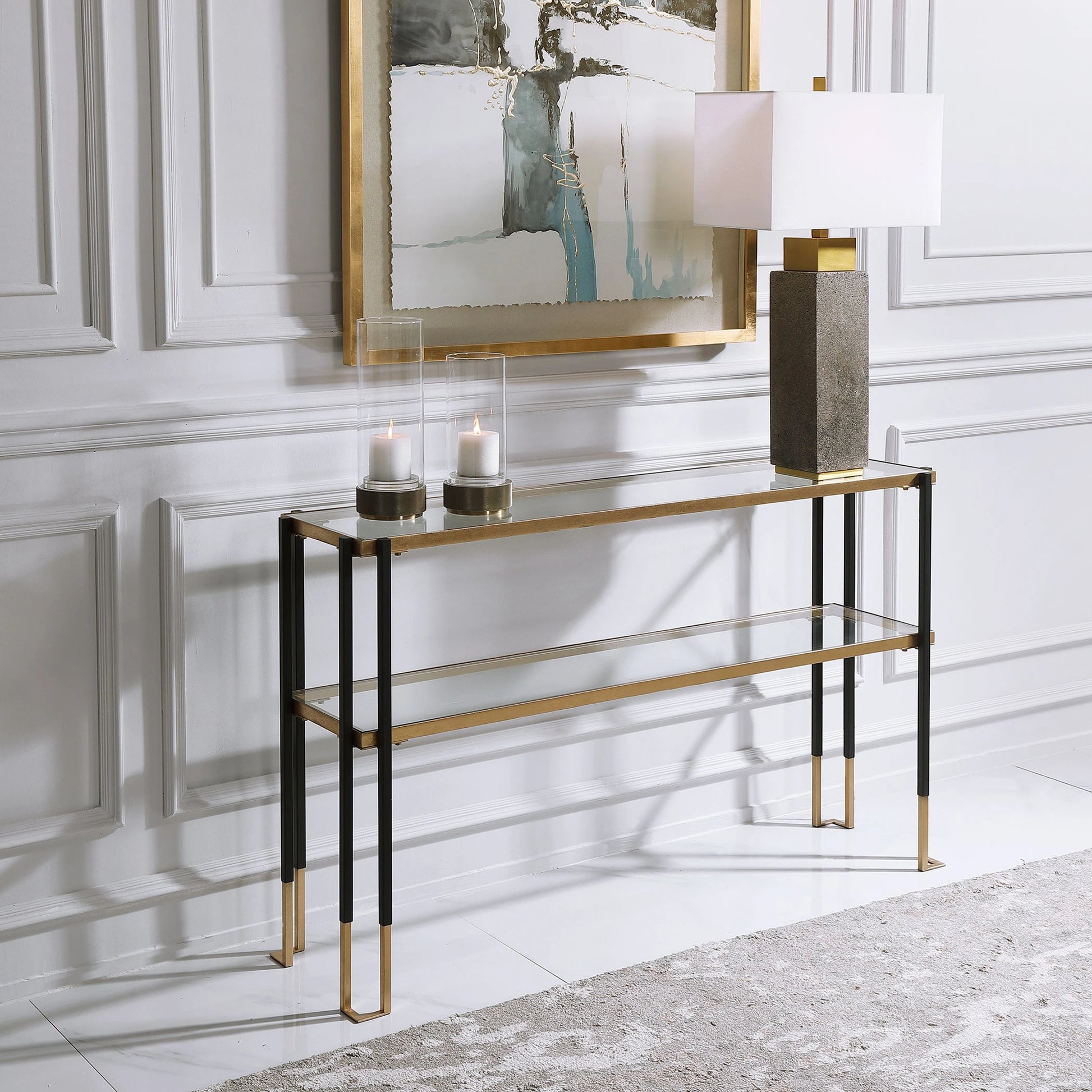 Kentmore Modern Console Table by Uttermost in matte black, brushed gold. Made from iron, glass in a transitional style.
