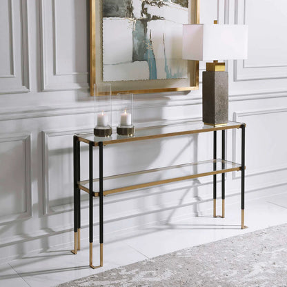 Kentmore Modern Console Table by Uttermost in matte black, brushed gold. Made from iron, glass in a transitional style.