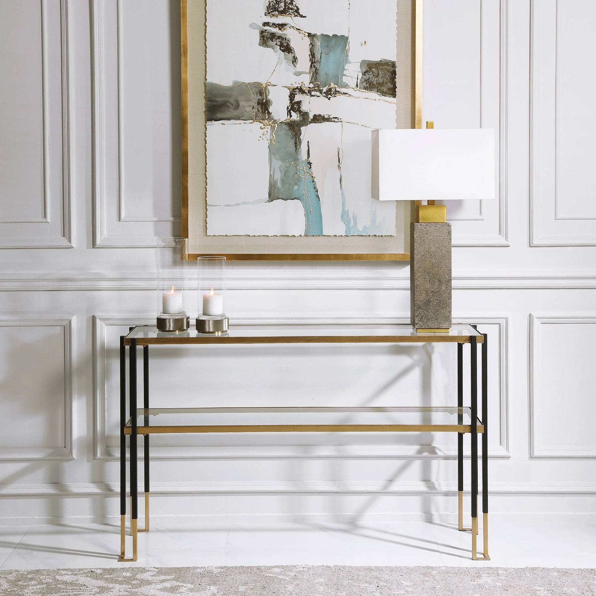 Kentmore Modern Console Table by Uttermost in matte black, brushed gold. Made from iron, glass in a transitional style.