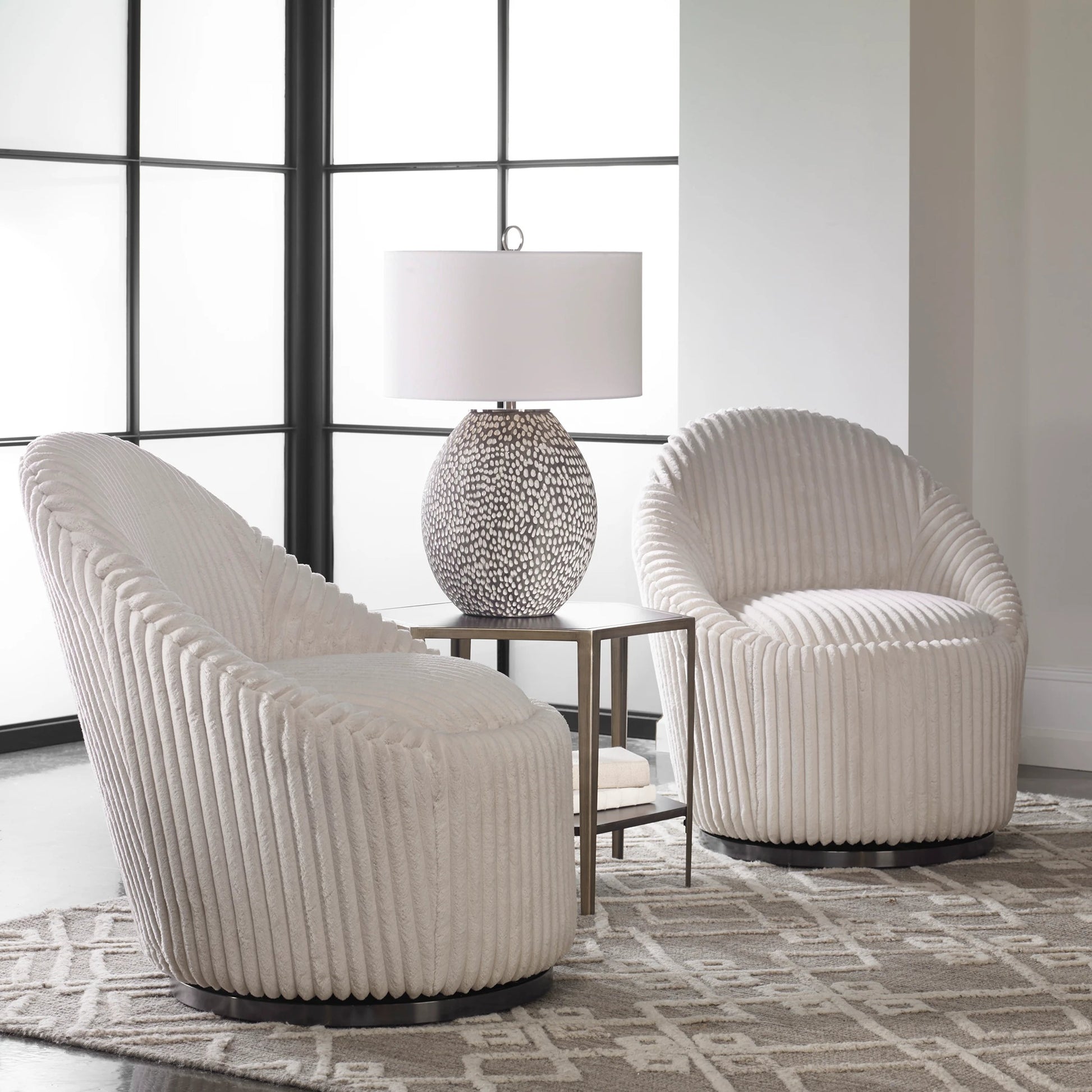 Crue Swivel Chair by Uttermost. Made from plywood, hardwood, fabric, foam, stainless steel in a modern style.
