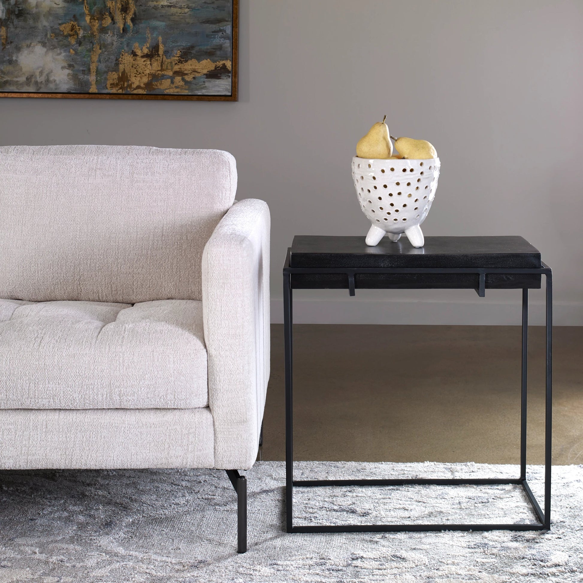 Telone Side Table by Uttermost in black. Made from iron, aluminum in a modern style.