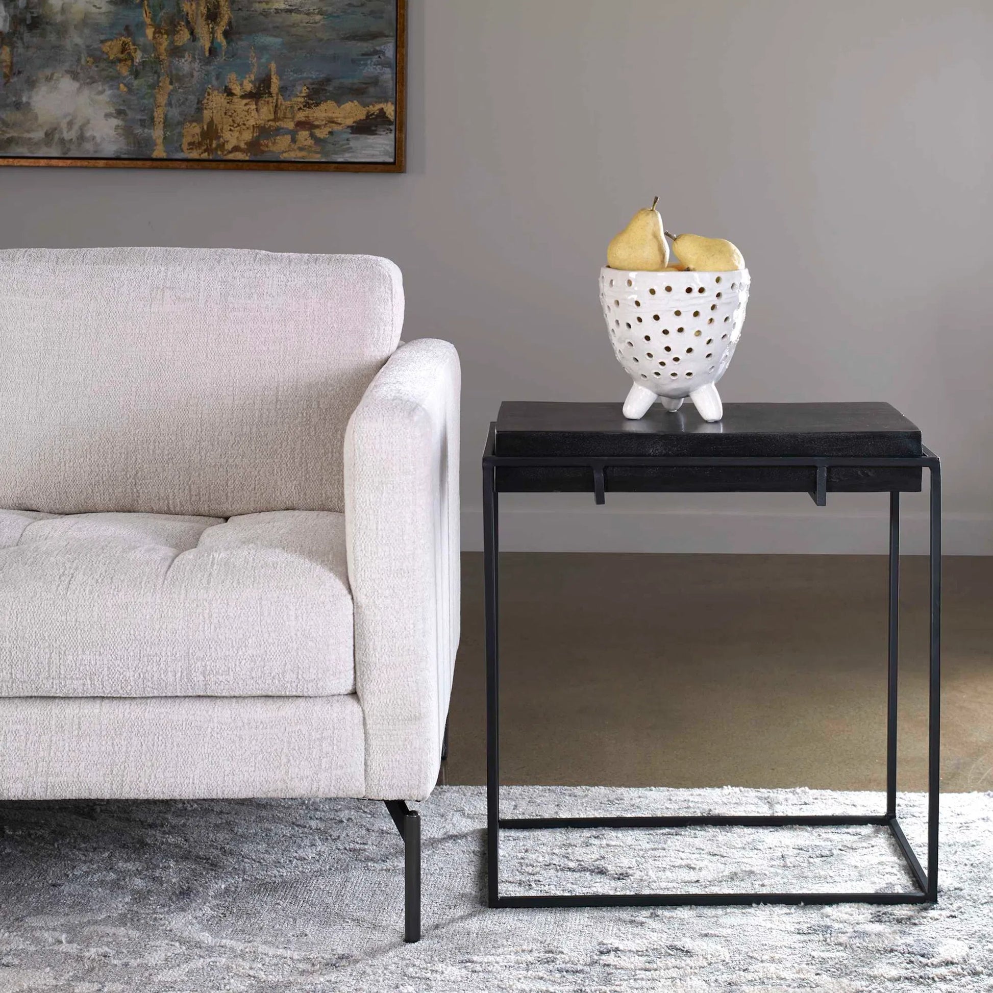 Telone Side Table by Uttermost in black. Made from iron, aluminum in a modern style.