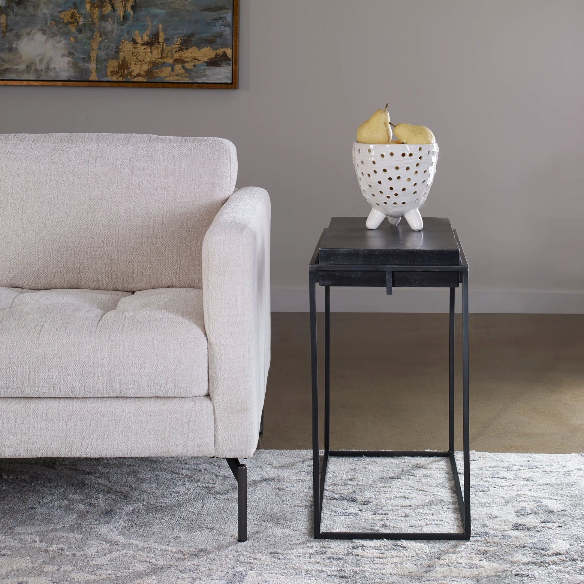 Telone Side Table by Uttermost in black. Made from iron, aluminum in a modern style.