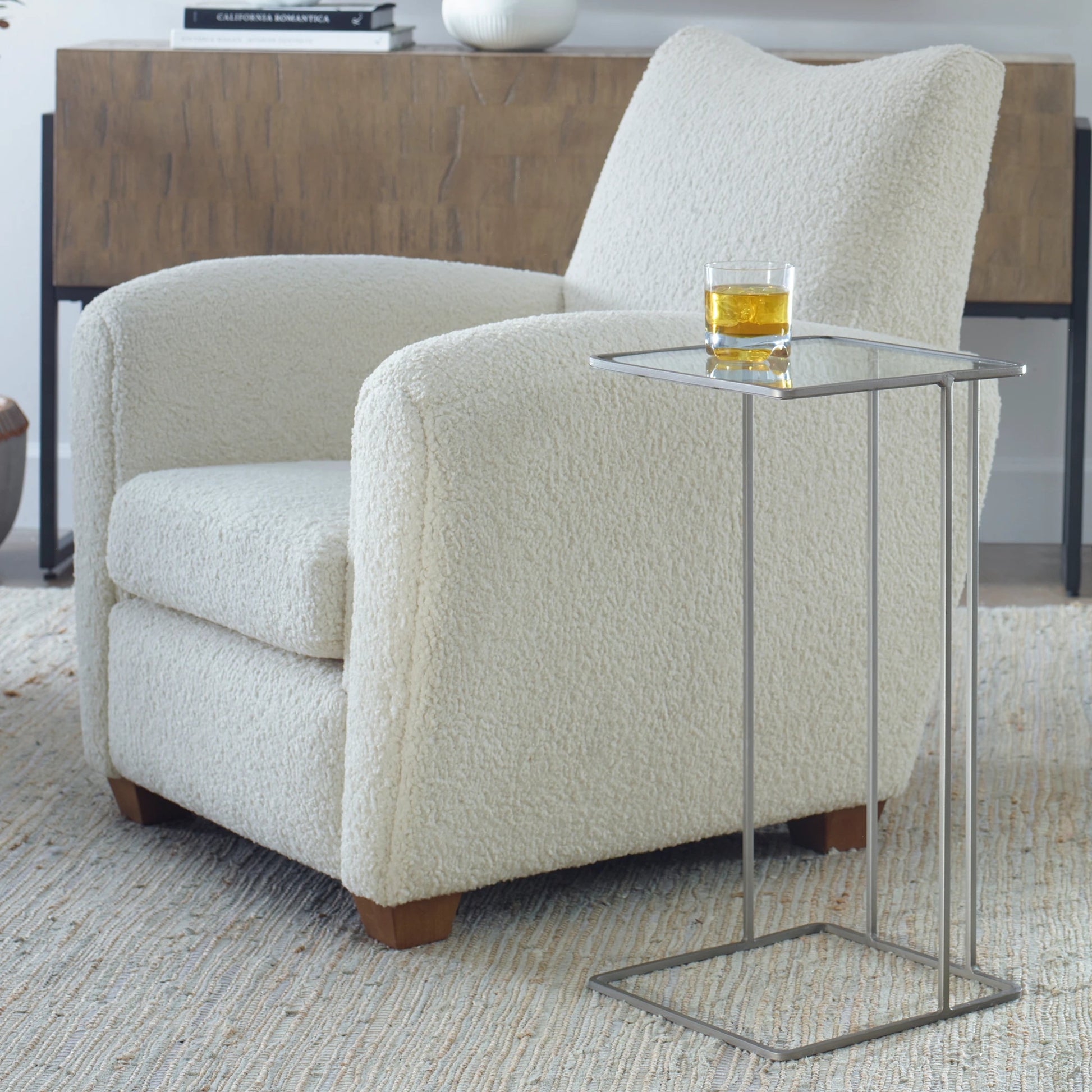 Cadmus Accent Table by Uttermost in black. Made from iron, glass in a modern style.