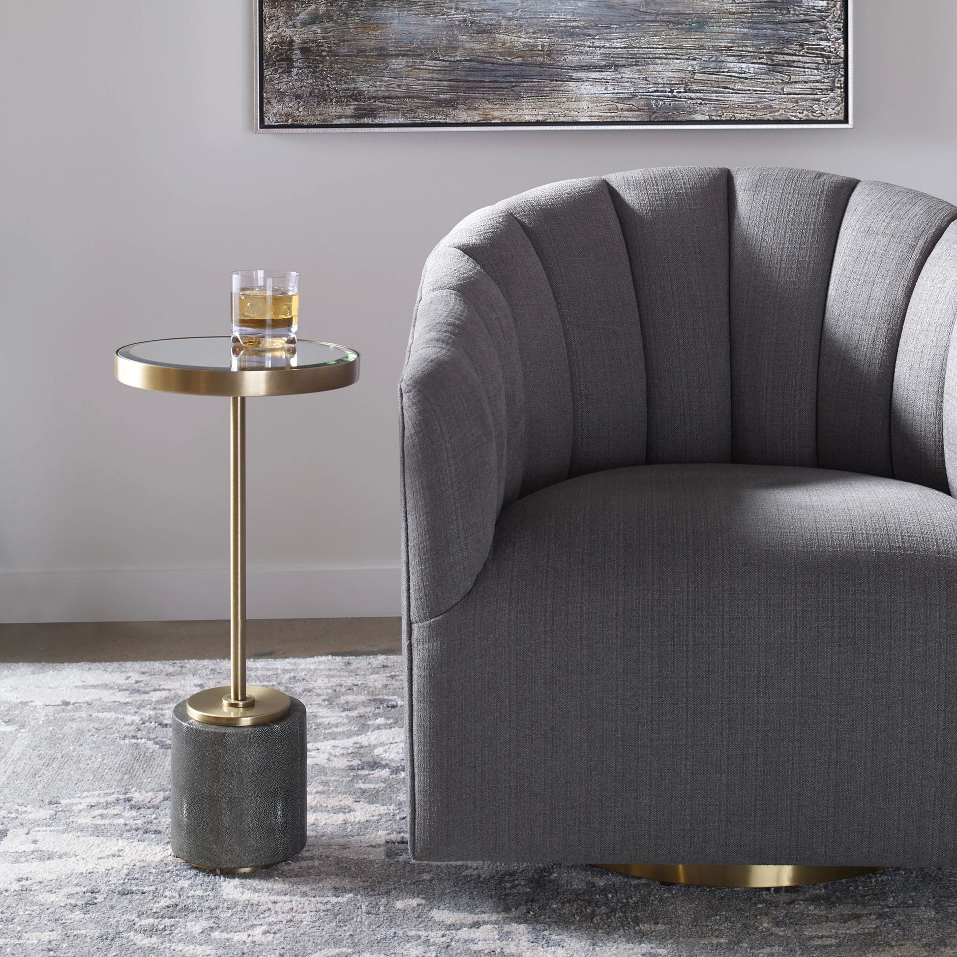 Laurier Accent Table by Uttermost in brass. Made from 50% iron, 15% glass, 10% faux ful, 25% pine wood in a transitional style.