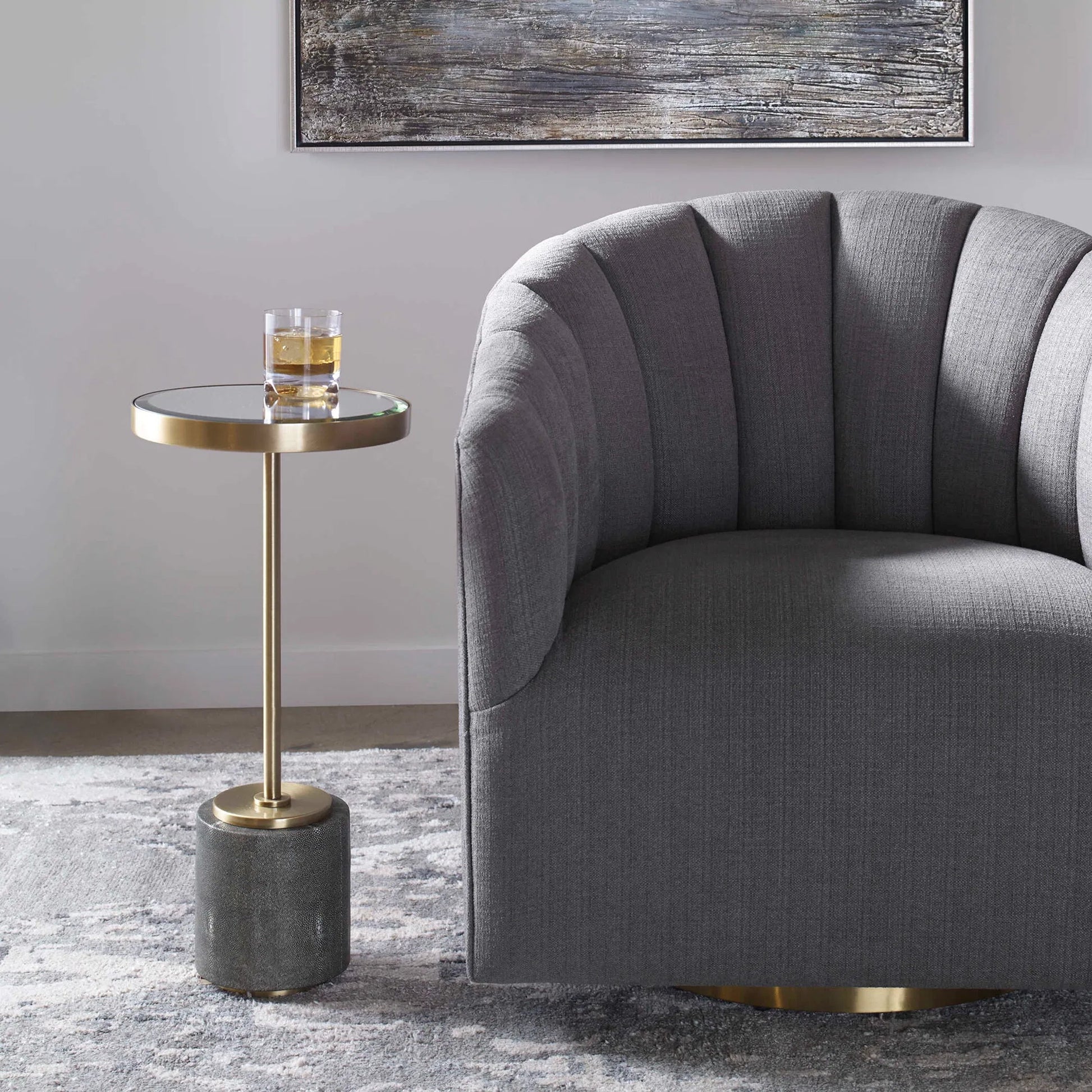 Laurier Accent Table by Uttermost in brass. Made from 50% iron, 15% glass, 10% faux ful, 25% pine wood in a transitional style.