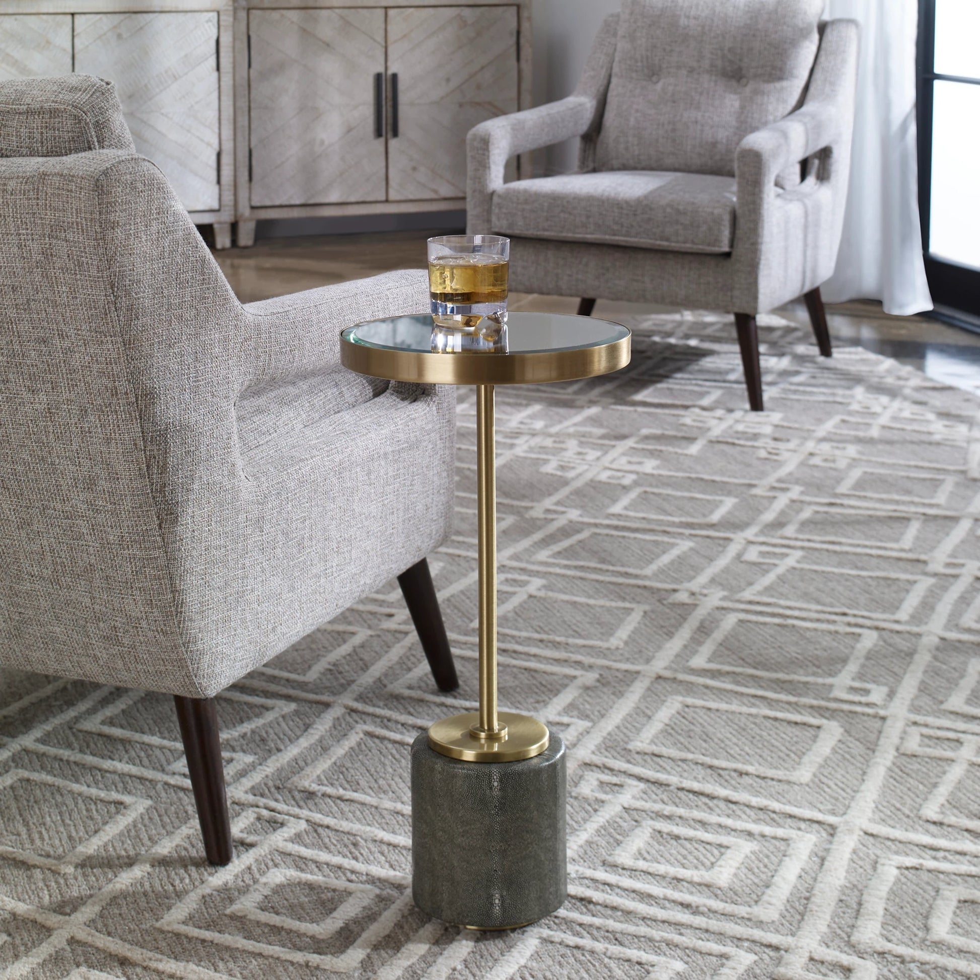 Laurier Accent Table by Uttermost in brass. Made from 50% iron, 15% glass, 10% faux ful, 25% pine wood in a transitional style.