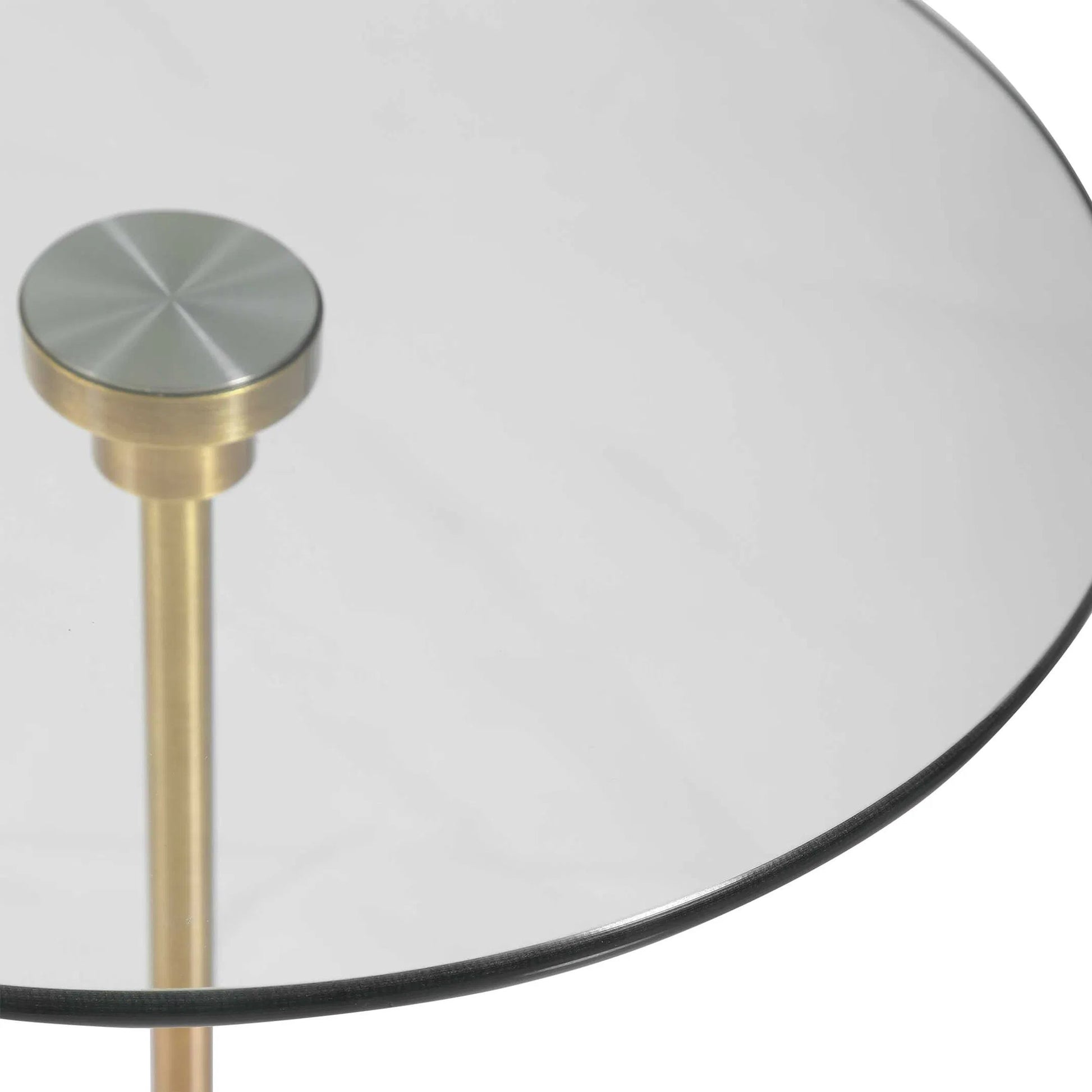 Portsmouth Accent Table by Uttermost in brushed brass. Made from iron, marble, glass in a modern style.