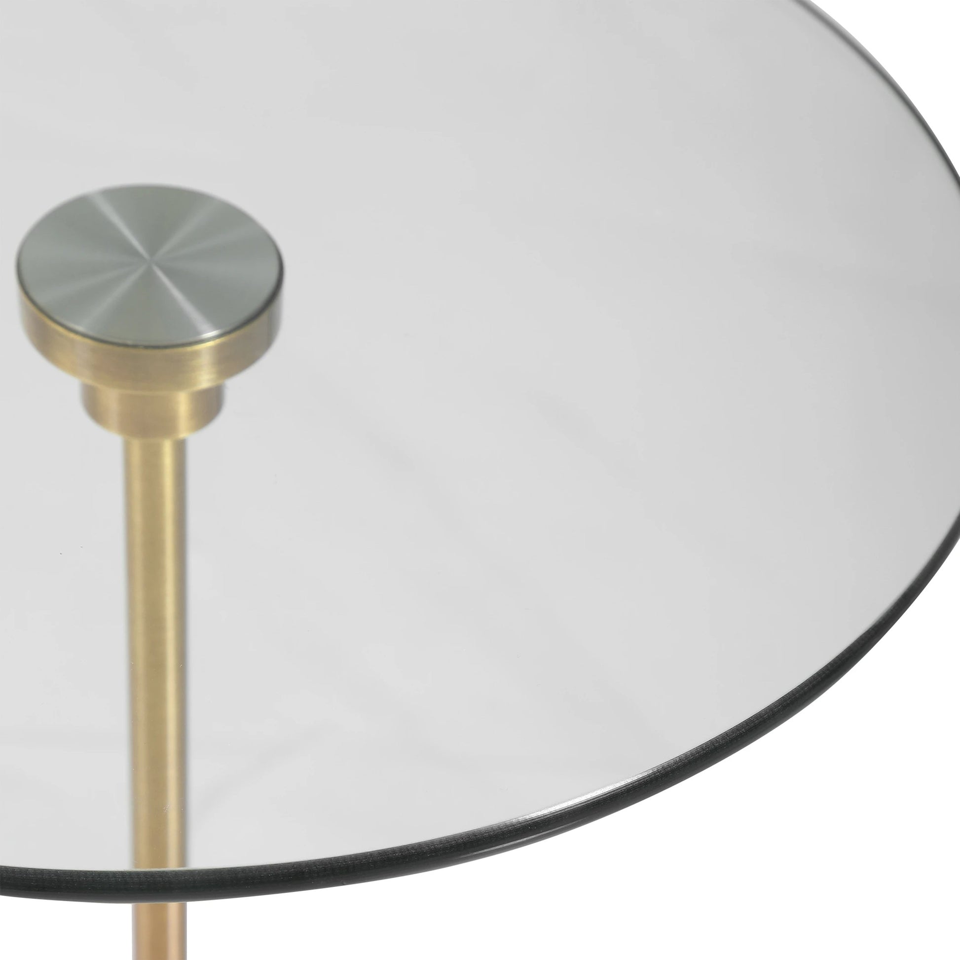 Portsmouth Accent Table by Uttermost in brushed brass. Made from iron, marble, glass in a modern style.