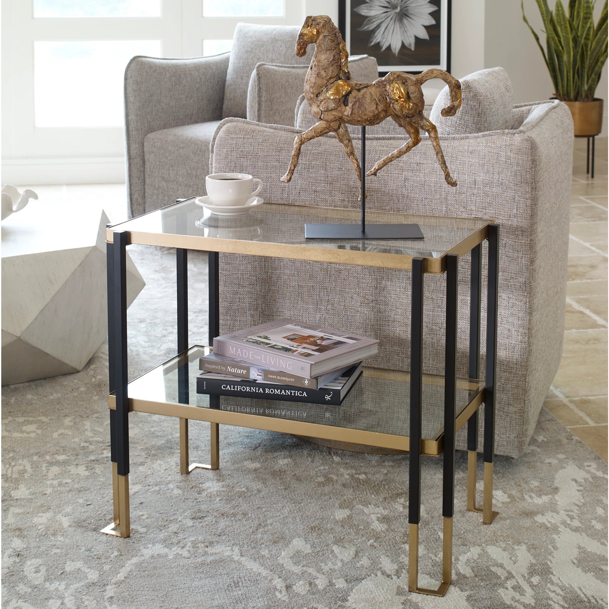 Kentmore Side Table by Uttermost in matte black, brushed gold. Made from iron, tempered glass in a transitional style.