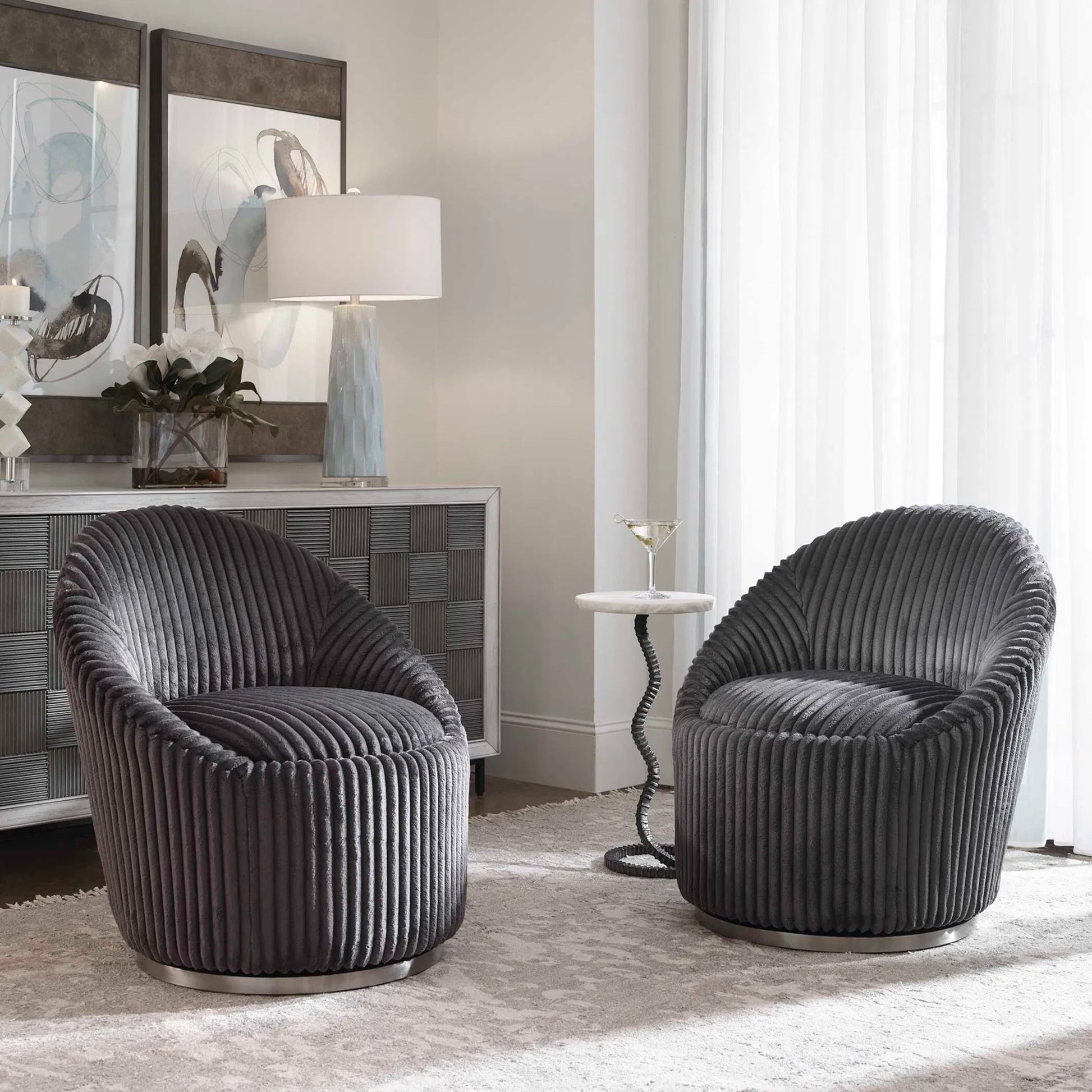 Crue Swivel Chair by Uttermost. Made from plywood, hardwood, fabric, foam, stainless steel in a modern style.