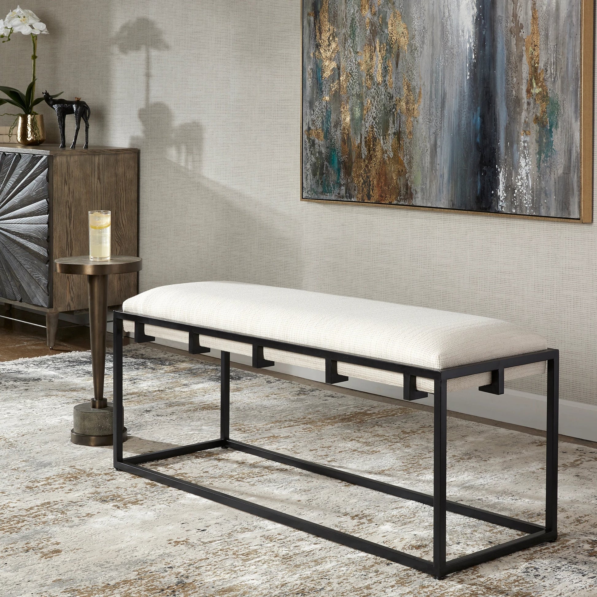 Paradox Bench by Uttermost in matte black. Made from iron, mdf, polyester, foam in a transitional style.