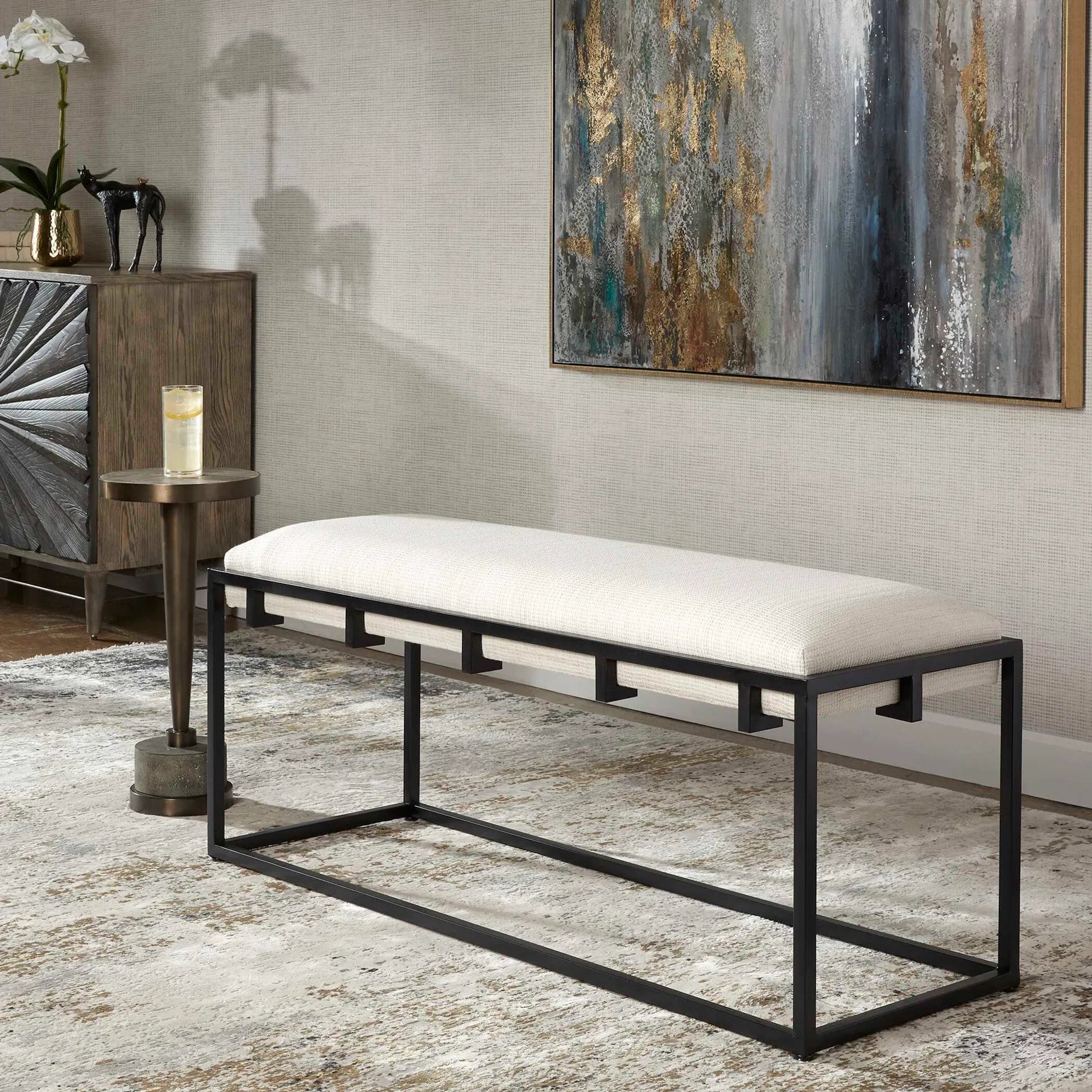 Paradox Bench by Uttermost in matte black. Made from iron, mdf, polyester, foam in a transitional style.