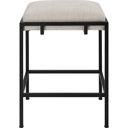 Paradox Counter Stool by Uttermost in matte black. Made from iron, mdf, foam, polyester in a modern style.