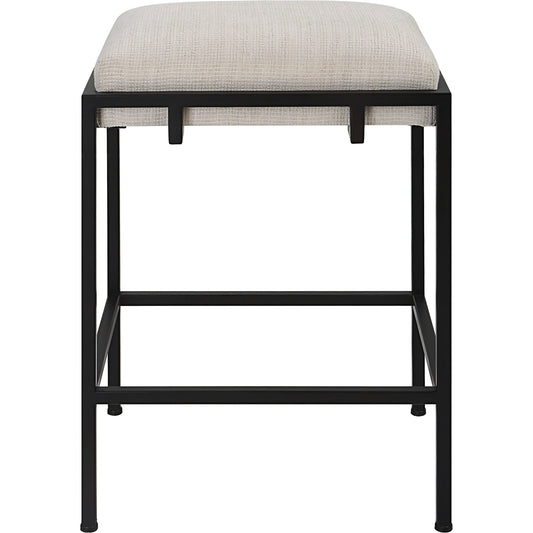 Paradox Counter Stool by Uttermost in matte black. Made from iron, mdf, foam, polyester in a modern style.