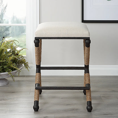 Firth Rustic Oatmeal Counter Stool by Uttermost in black, natural. Made from mdf, farbic, iron, foam, rope in a coastal style.
