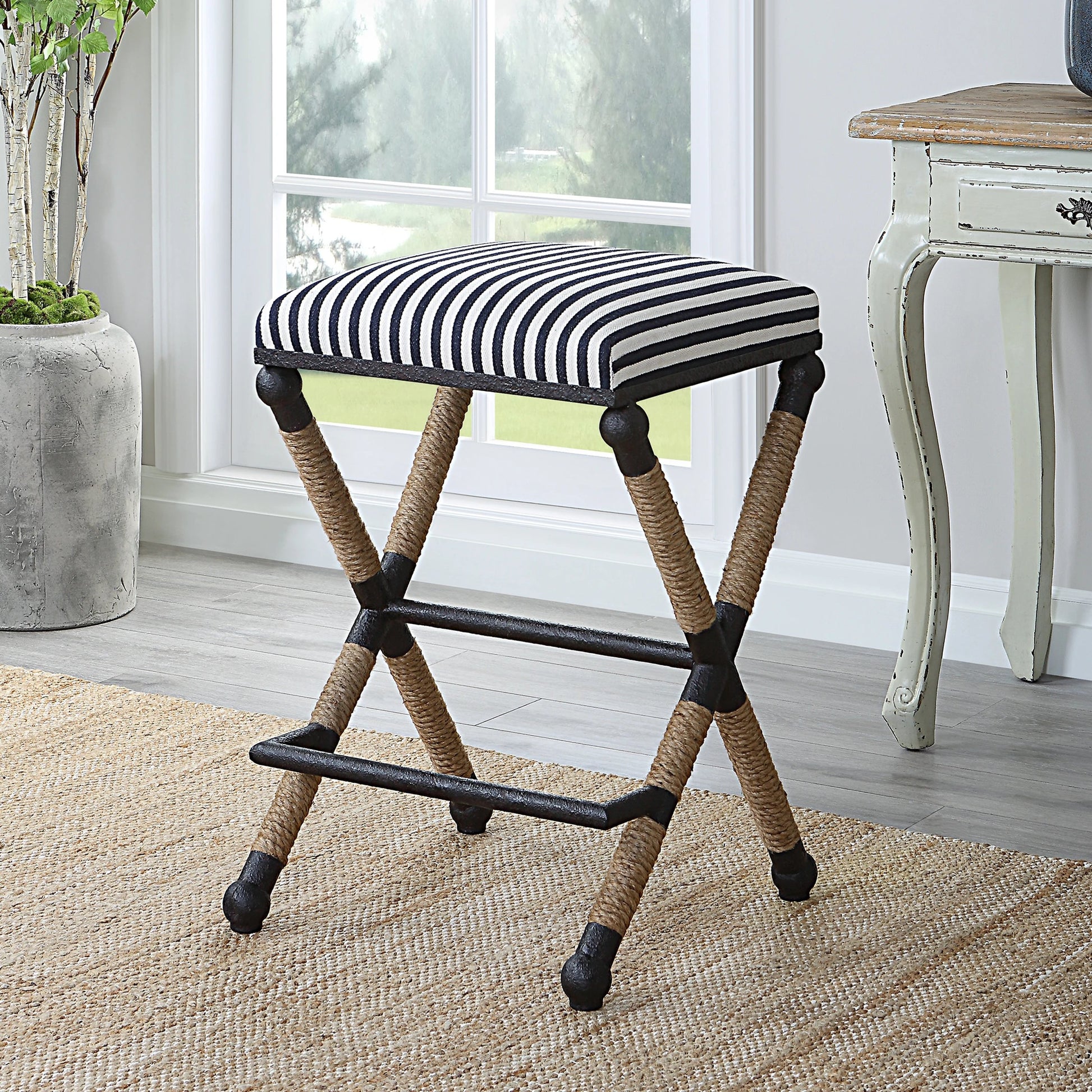 Braddock Counter Stool by Uttermost in navy, cream and iron. Made from mdf, farbic, iron, foam, rope in a coastal style.