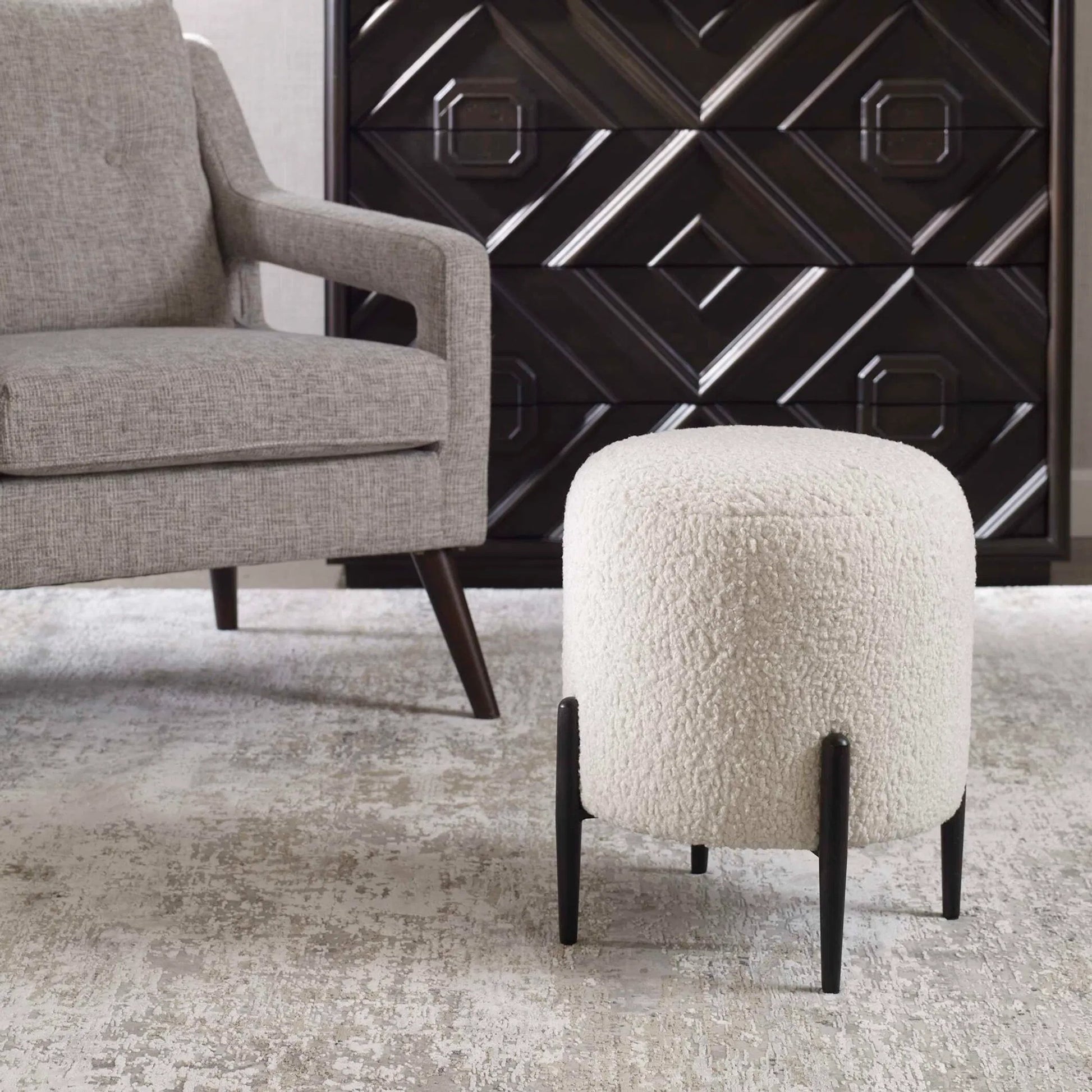 Arles Ottoman by Uttermost in white and satin black. Made from hardwood, plywood, fabric, foam in a transitional style.