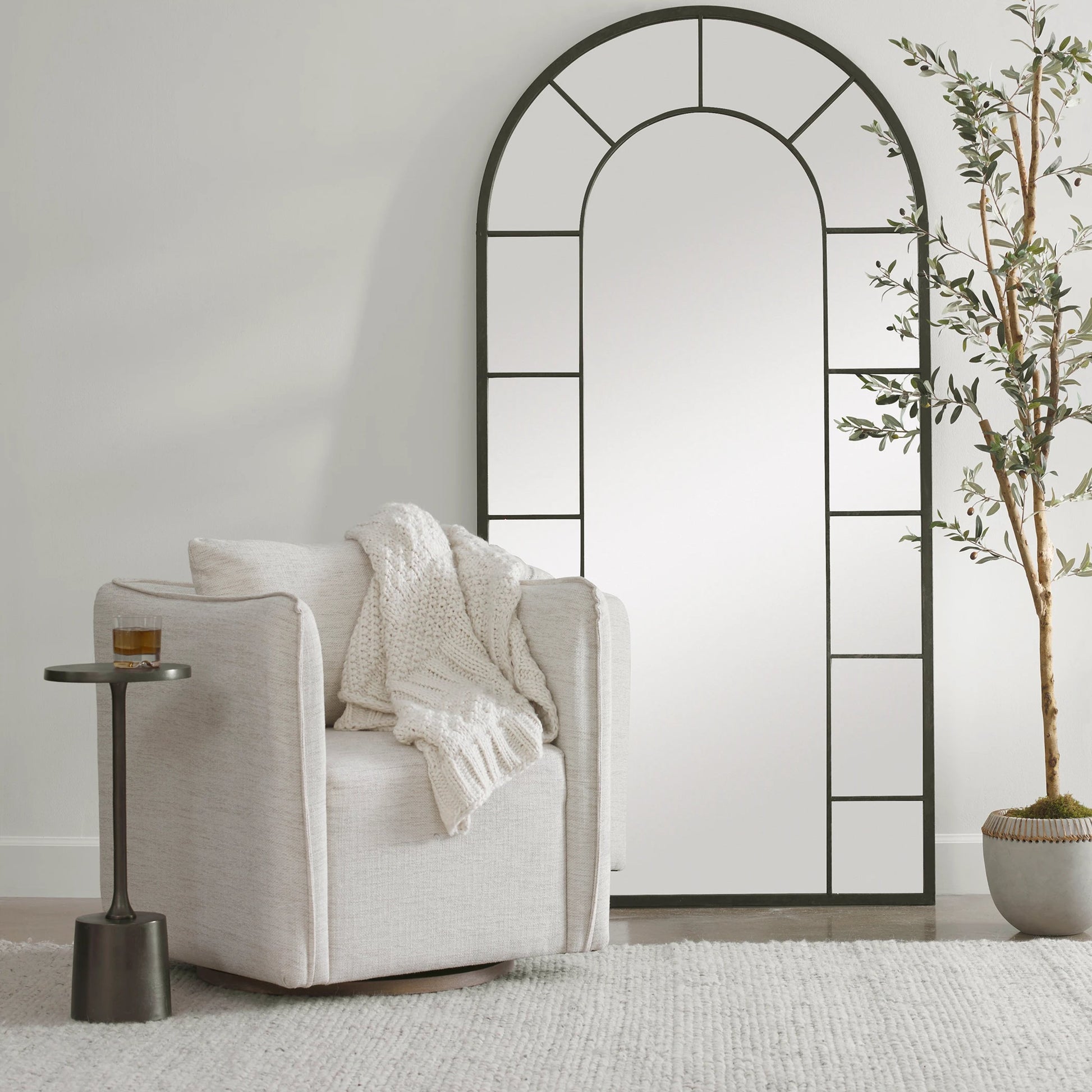 Corben Swivel Armchair by Uttermost in gray. Made from hardwood, plywood, fabric, foam in a modern style.