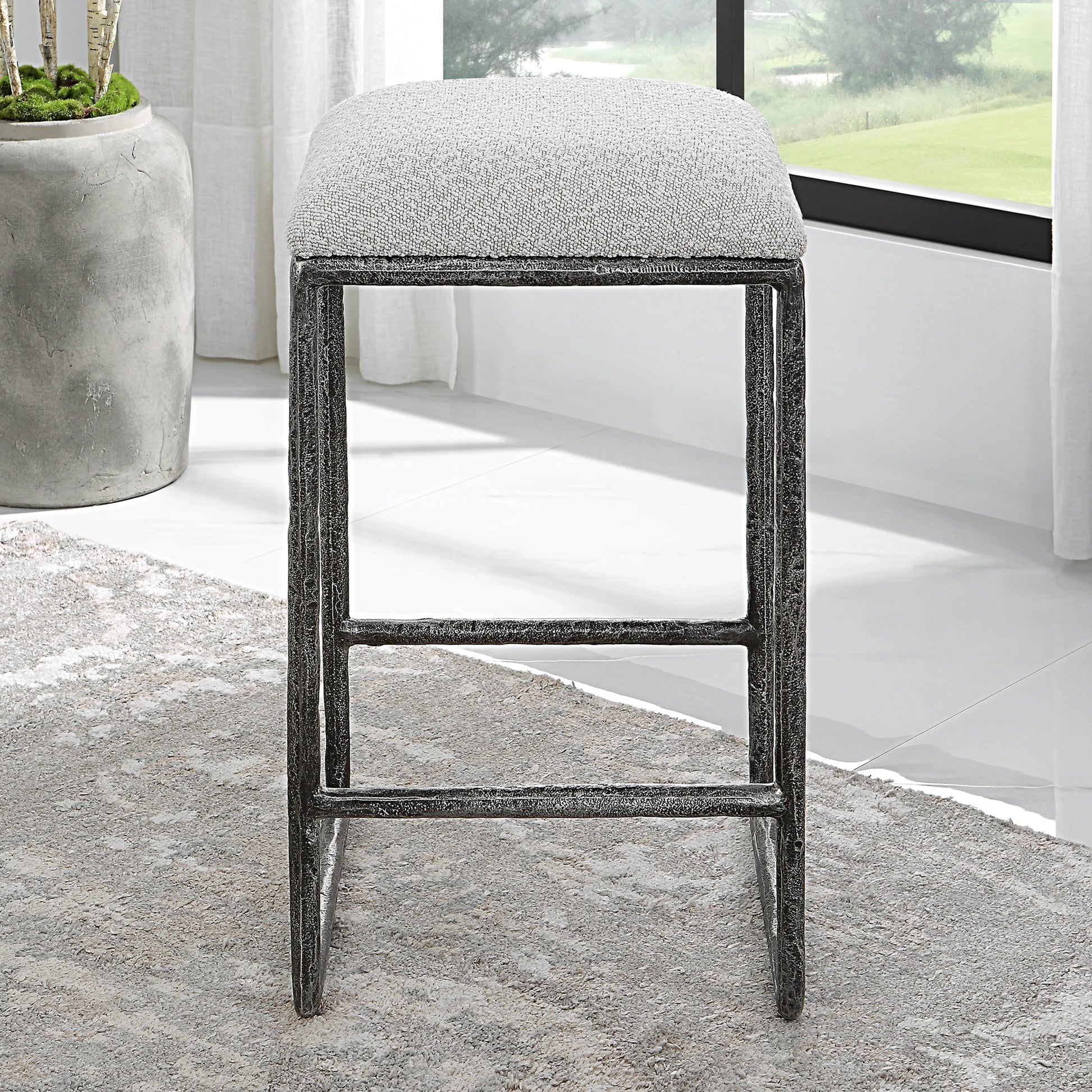 Brisbane Counter Stool by Uttermost in ivory, gray and charcoal. Made from cast iron, mdf, foam, fabric in a modern style.