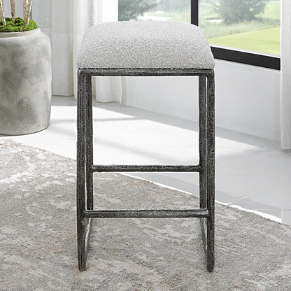 Brisbane Counter Stool by Uttermost in ivory, gray and charcoal. Made from cast iron, mdf, foam, fabric in a modern style.