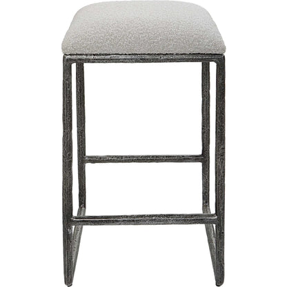Brisbane Counter Stool by Uttermost in ivory, gray and charcoal. Made from cast iron, mdf, foam, fabric in a modern style.