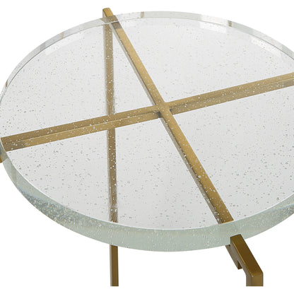 Star-Crossed Accent Table by Uttermost in gold. Made from seeded thick glass, stainless steel in a modern style.