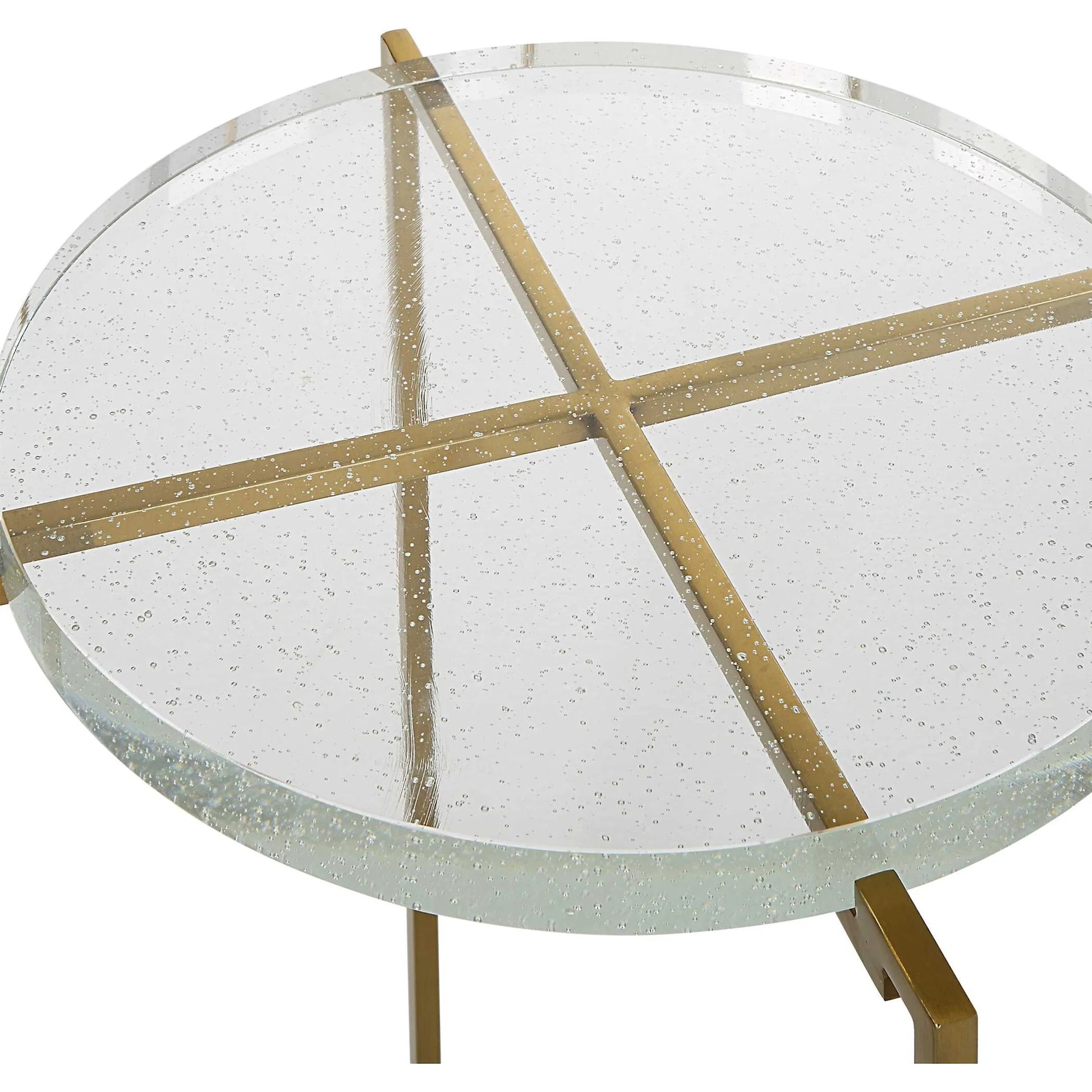 Star-Crossed Accent Table by Uttermost in gold. Made from seeded thick glass, stainless steel in a modern style.