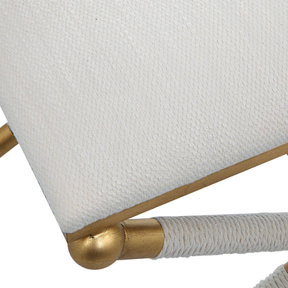 Socialite Bench by Uttermost in white and gold leaf. Made from iron, mdf, fabric, foam, yarn in a modern style.