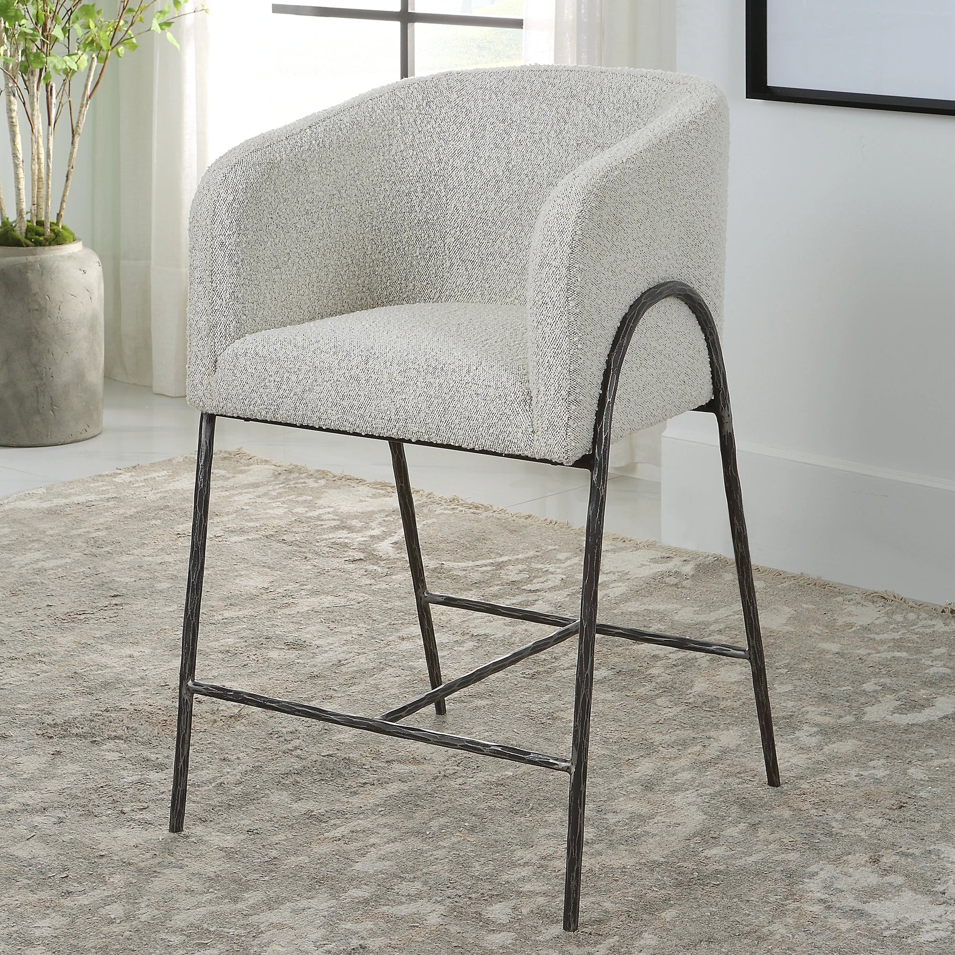 Jacobsen Counter Stool by Uttermost in ivory, warm gray and iron. Made from steel, foam, fabric, eucalyptus in a modern style.