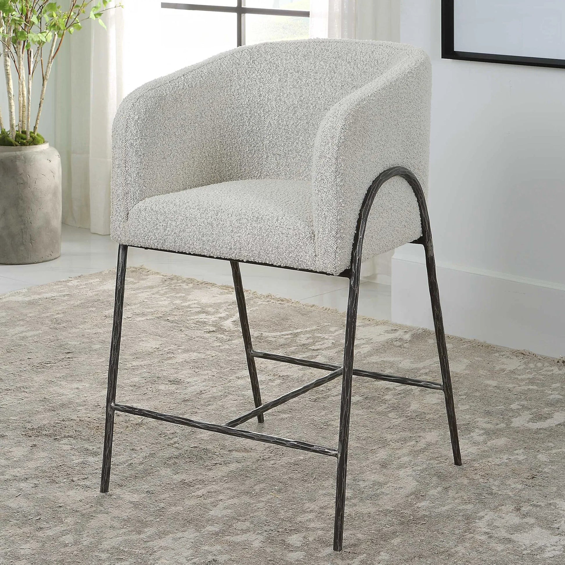 Jacobsen Counter Stool by Uttermost in ivory, warm gray and iron. Made from steel, foam, fabric, eucalyptus in a modern style.
