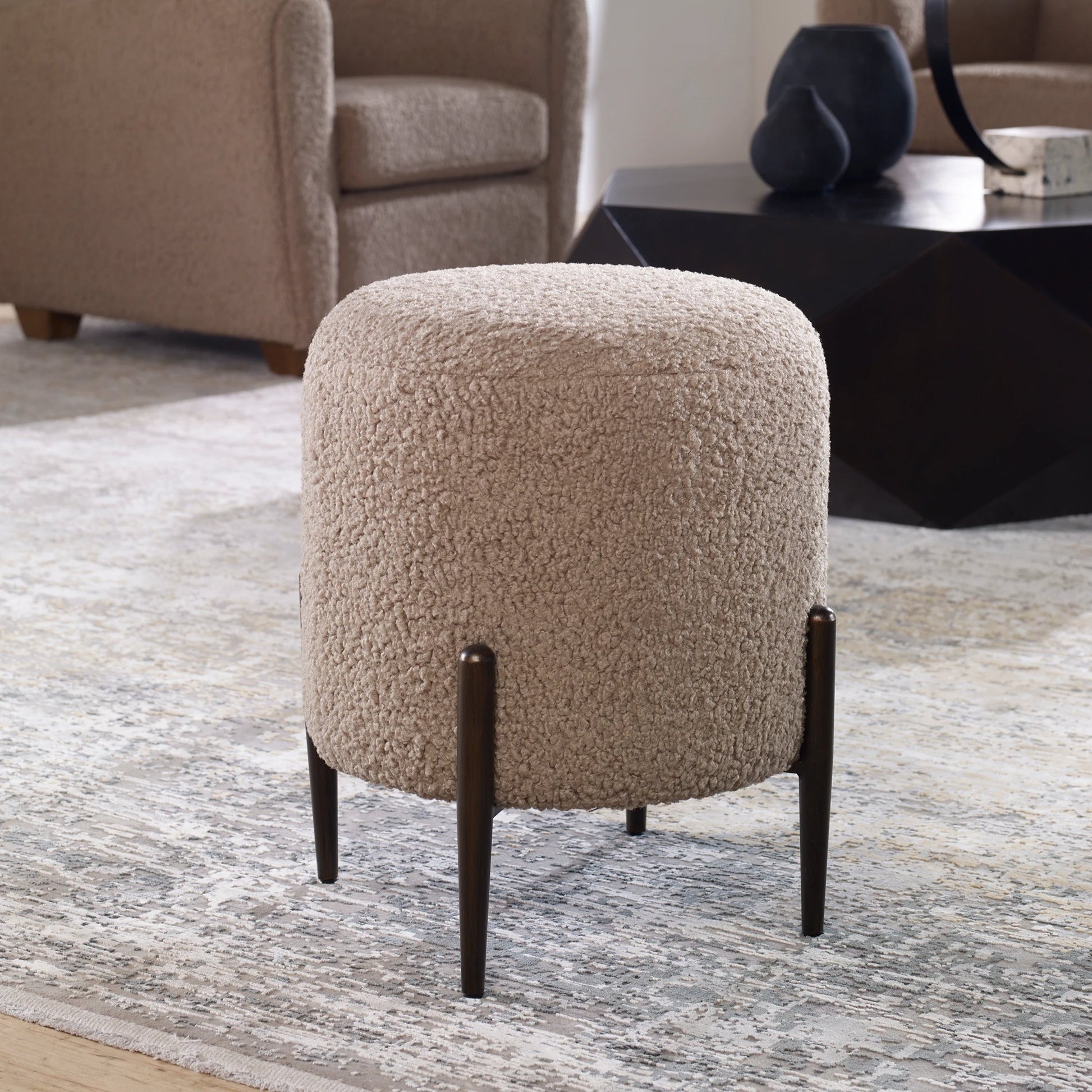Arles Ottoman by Uttermost in white and satin black. Made from hardwood, plywood, fabric, foam in a transitional style.