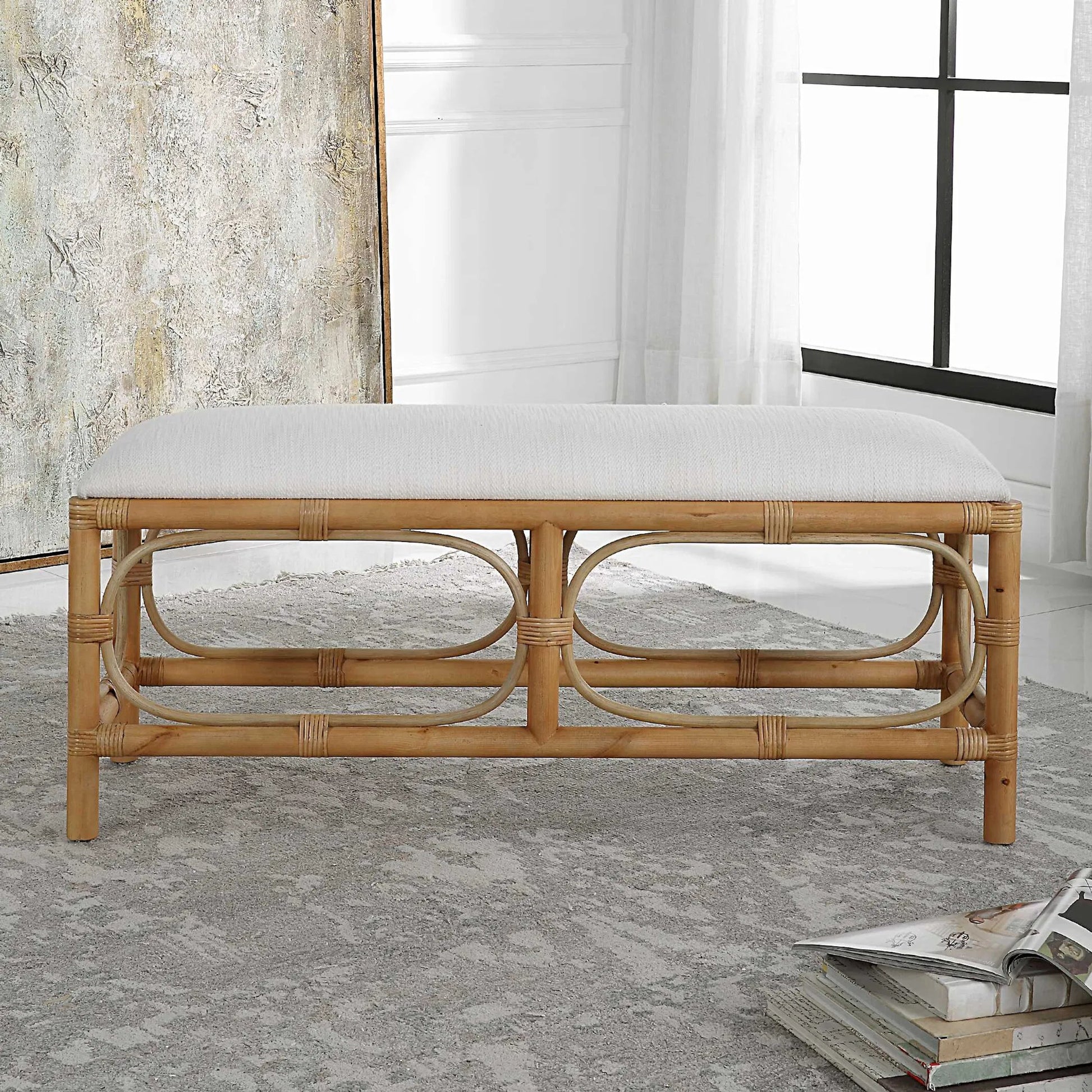 Laguna Bench by Uttermost in white. Made from mdf, pine, rattan, polyester, foam in a coastal style.