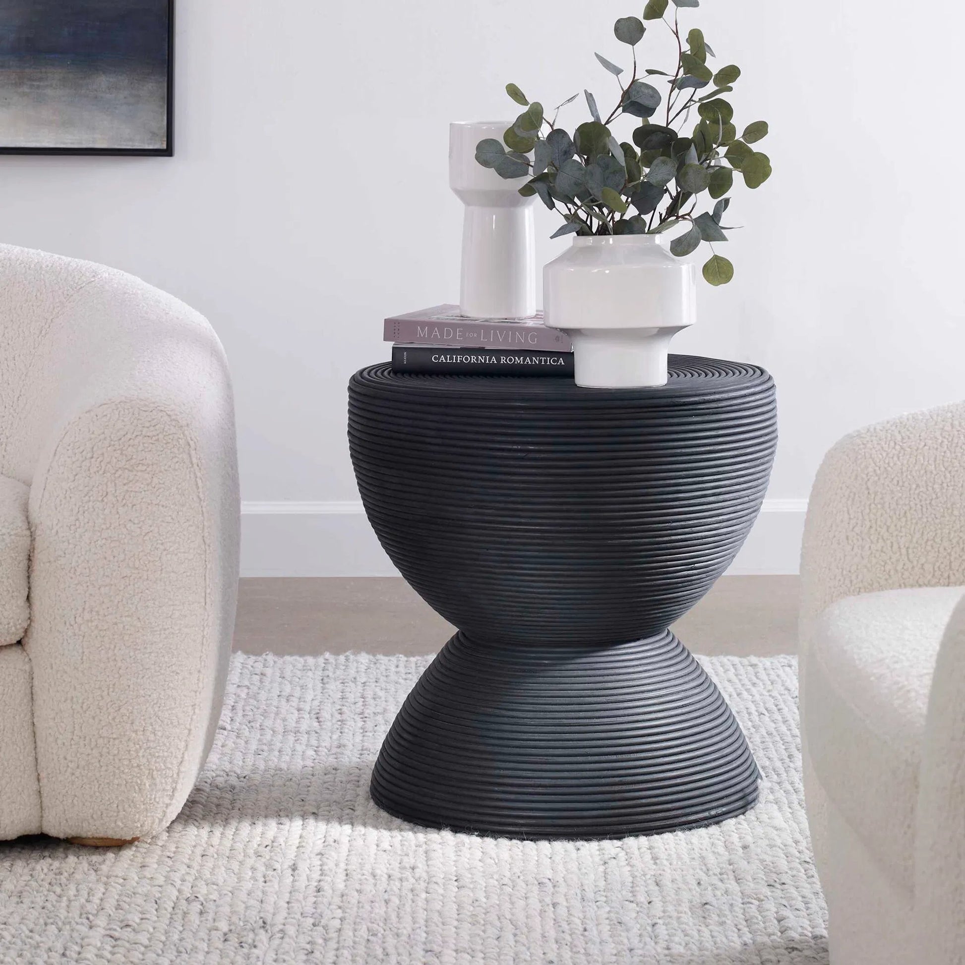 Bongo Side Table by Uttermost in black. Made from rattan in a modern style.