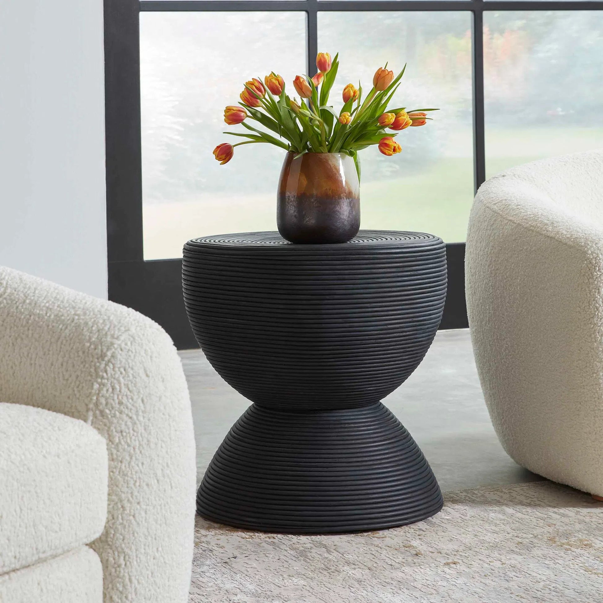 Bongo Side Table by Uttermost in black. Made from rattan in a modern style.