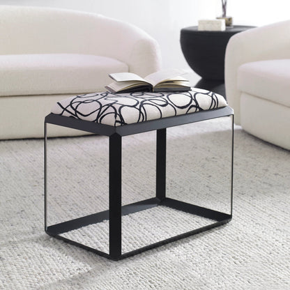 Curls Bench by Uttermost in stone gray and satin black. Made from iron, mdf, polyester, foam in a modern style.
