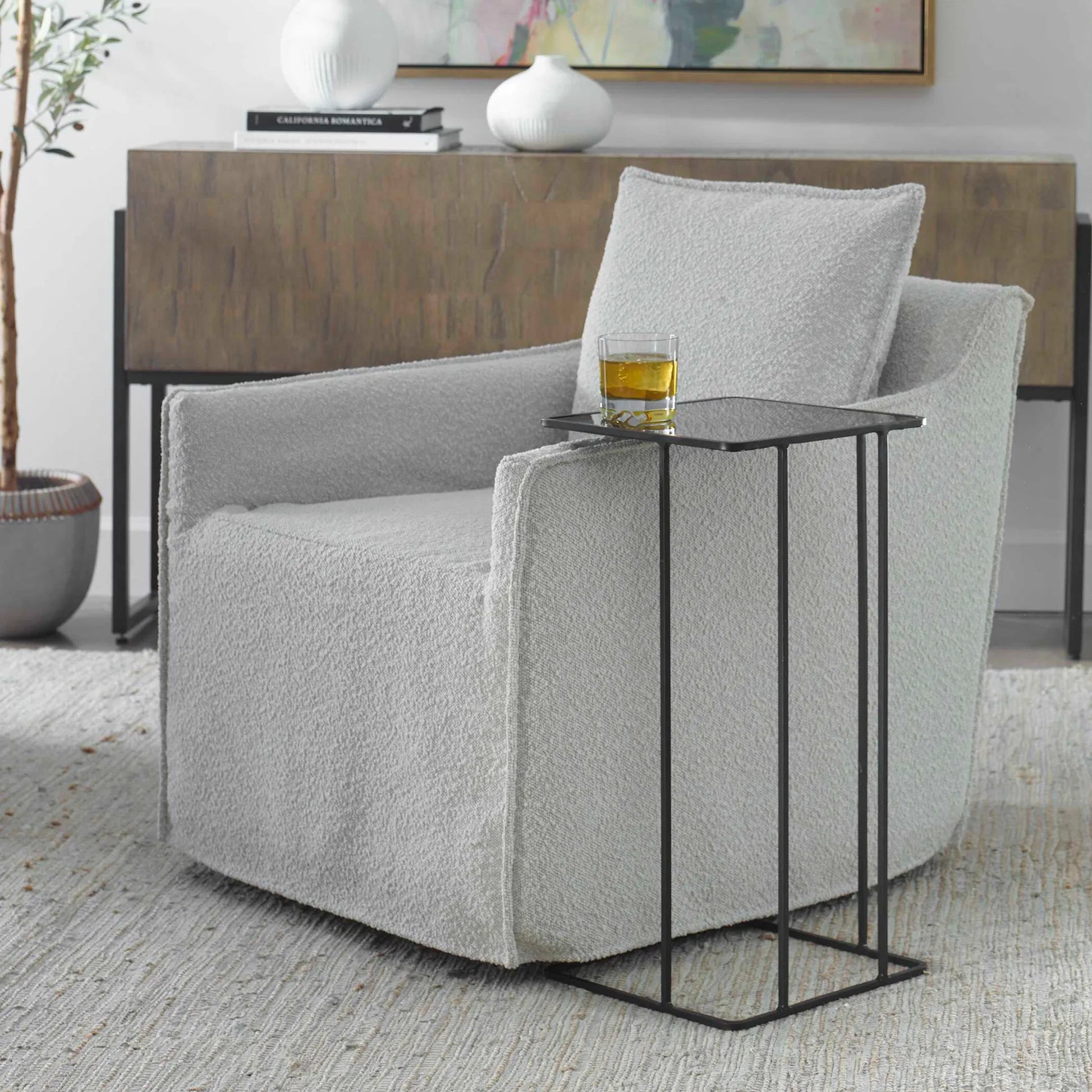 Cadmus Accent Table by Uttermost in black. Made from iron, glass in a modern style.