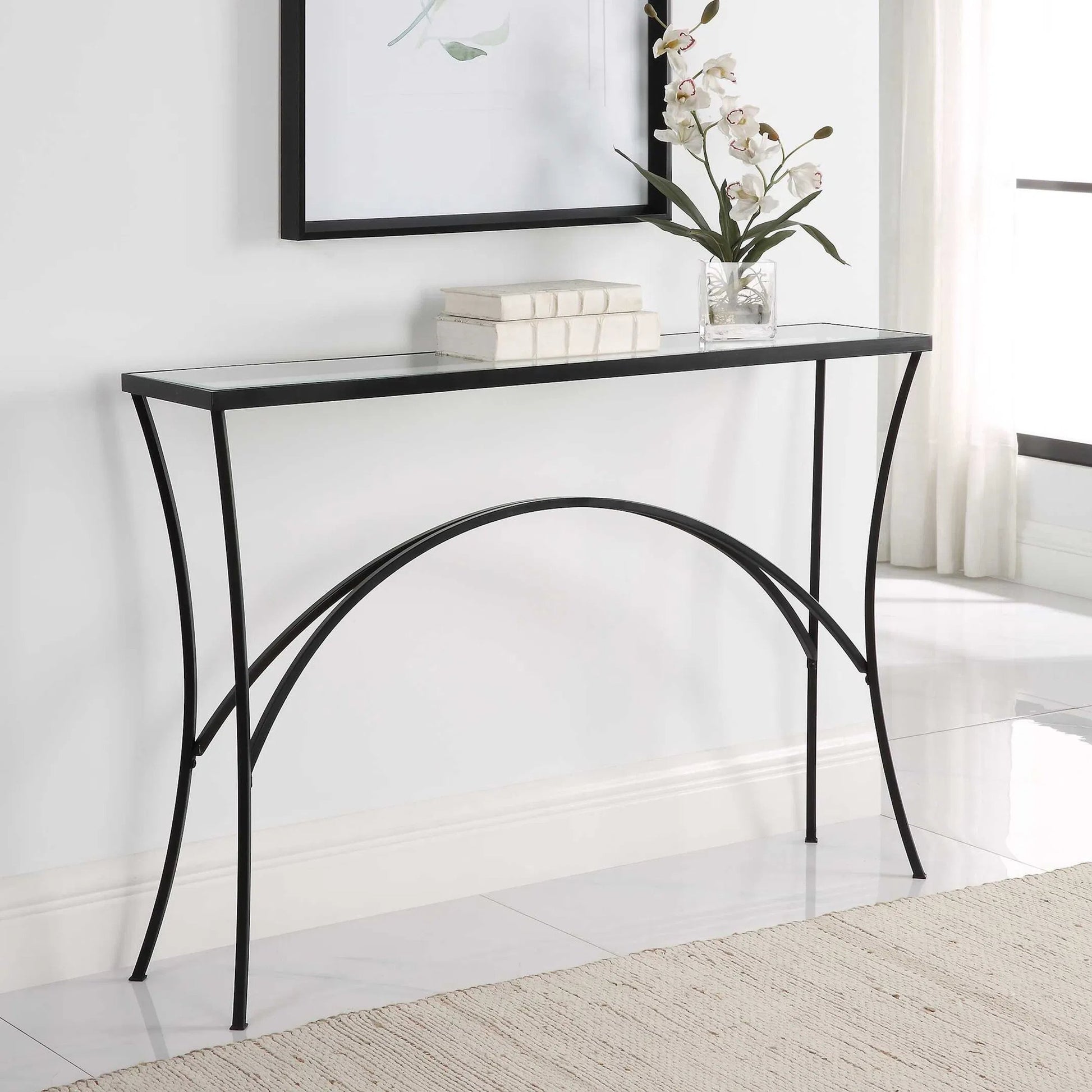 Alayna Console Table by Uttermost in black. Made from metal, tempered glass in a modern style.