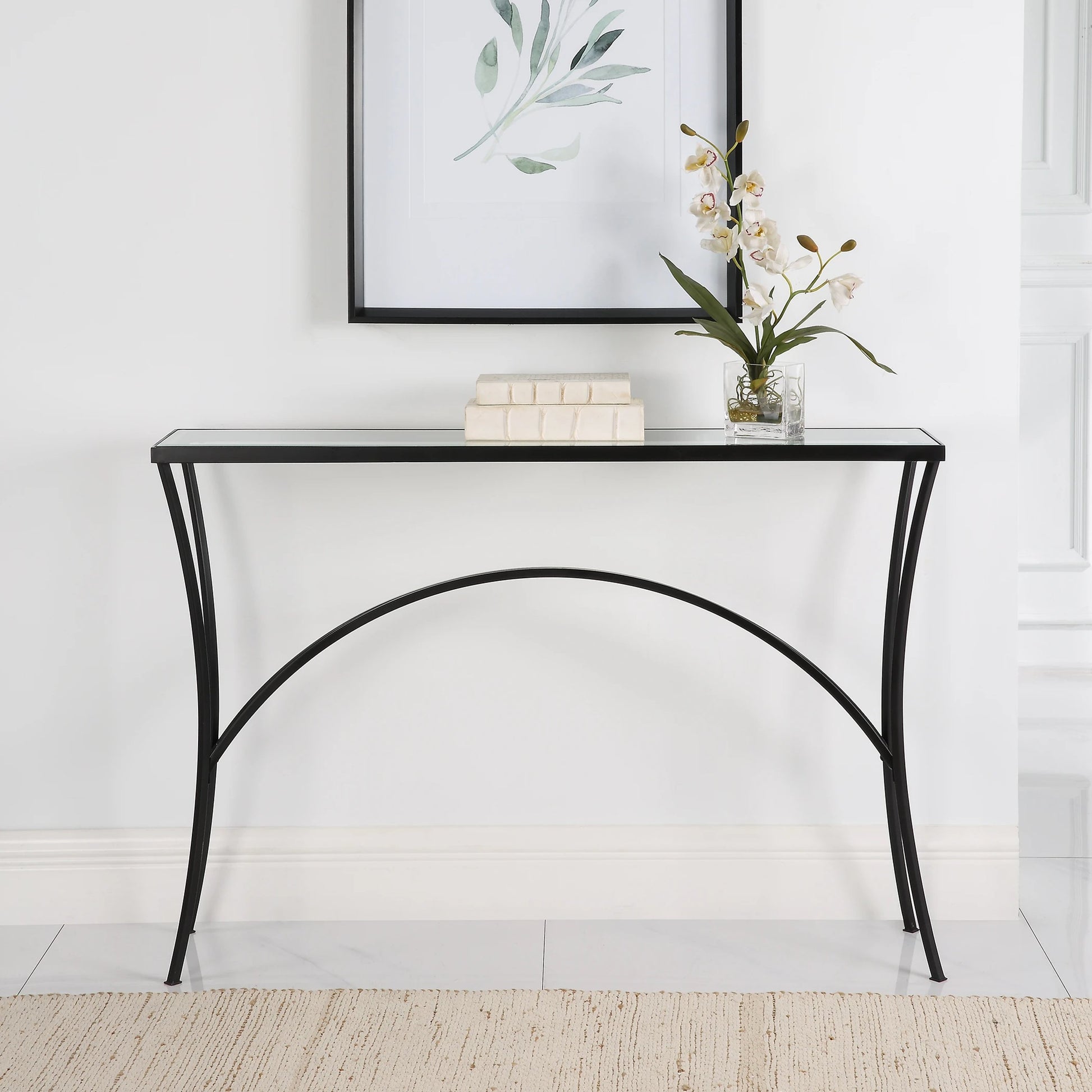 Alayna Console Table by Uttermost in black. Made from metal, tempered glass in a modern style.