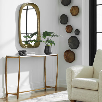 Affinity Console Table by Uttermost in gold. Made from marble, aluminum in a modern style.