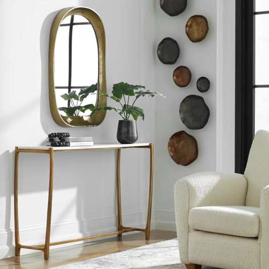 Affinity Console Table by Uttermost in gold. Made from marble, aluminum in a modern style.