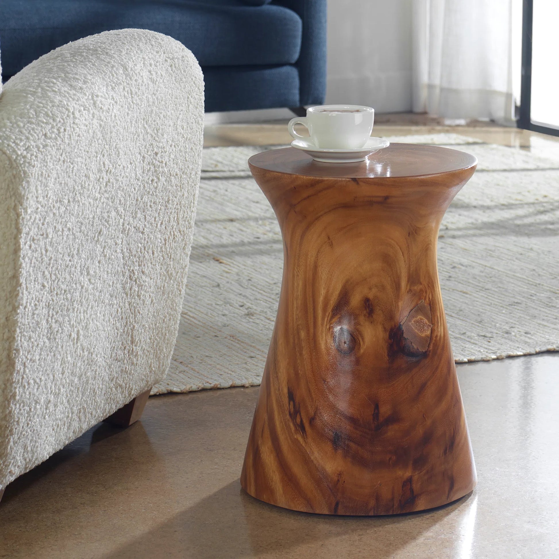 Swell Accent Table by Uttermost in natural honey. Made from suar wood in a rustic style.