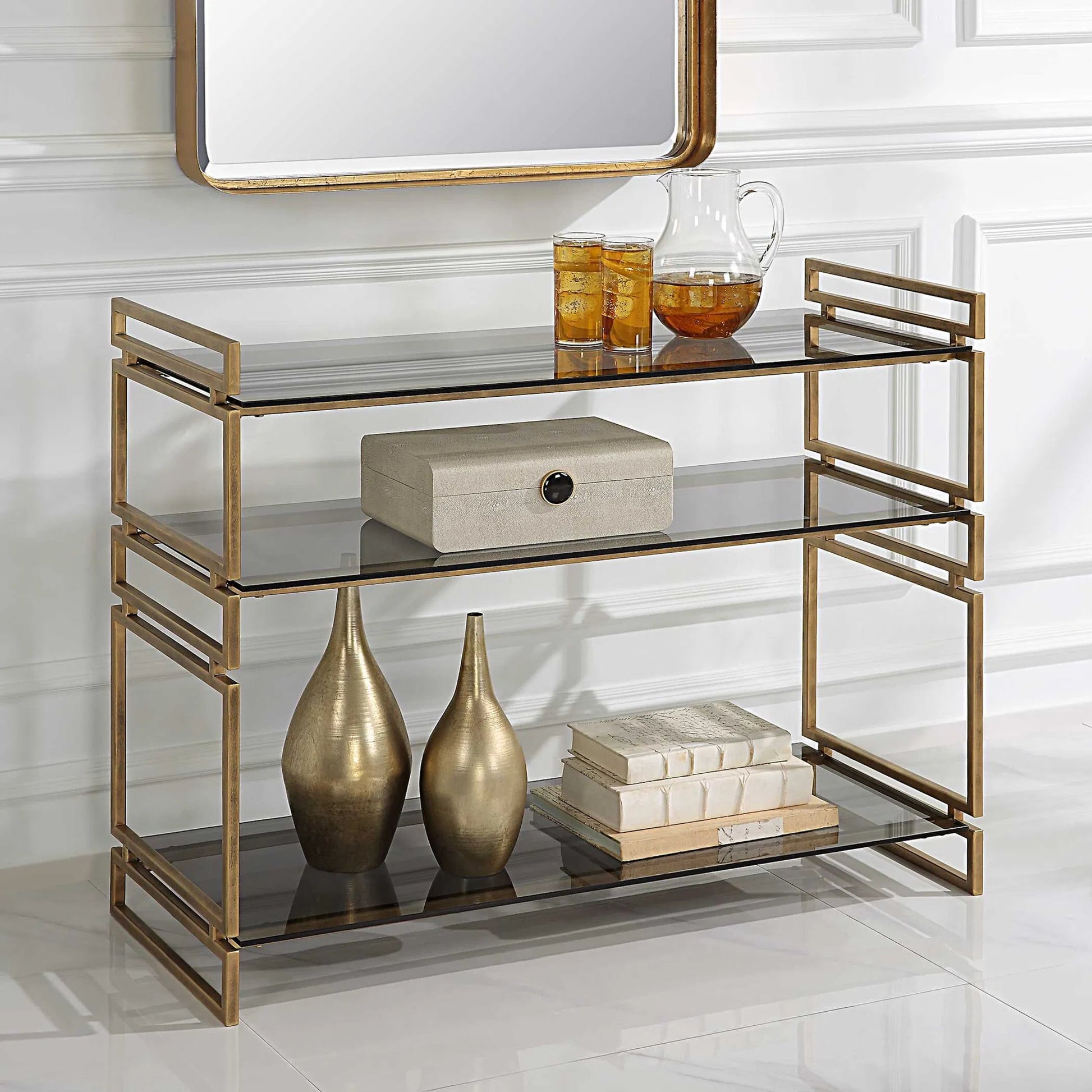 Stacked Up Console Table by Uttermost in antiqued gold. Made from iron, glass in a modern style.
