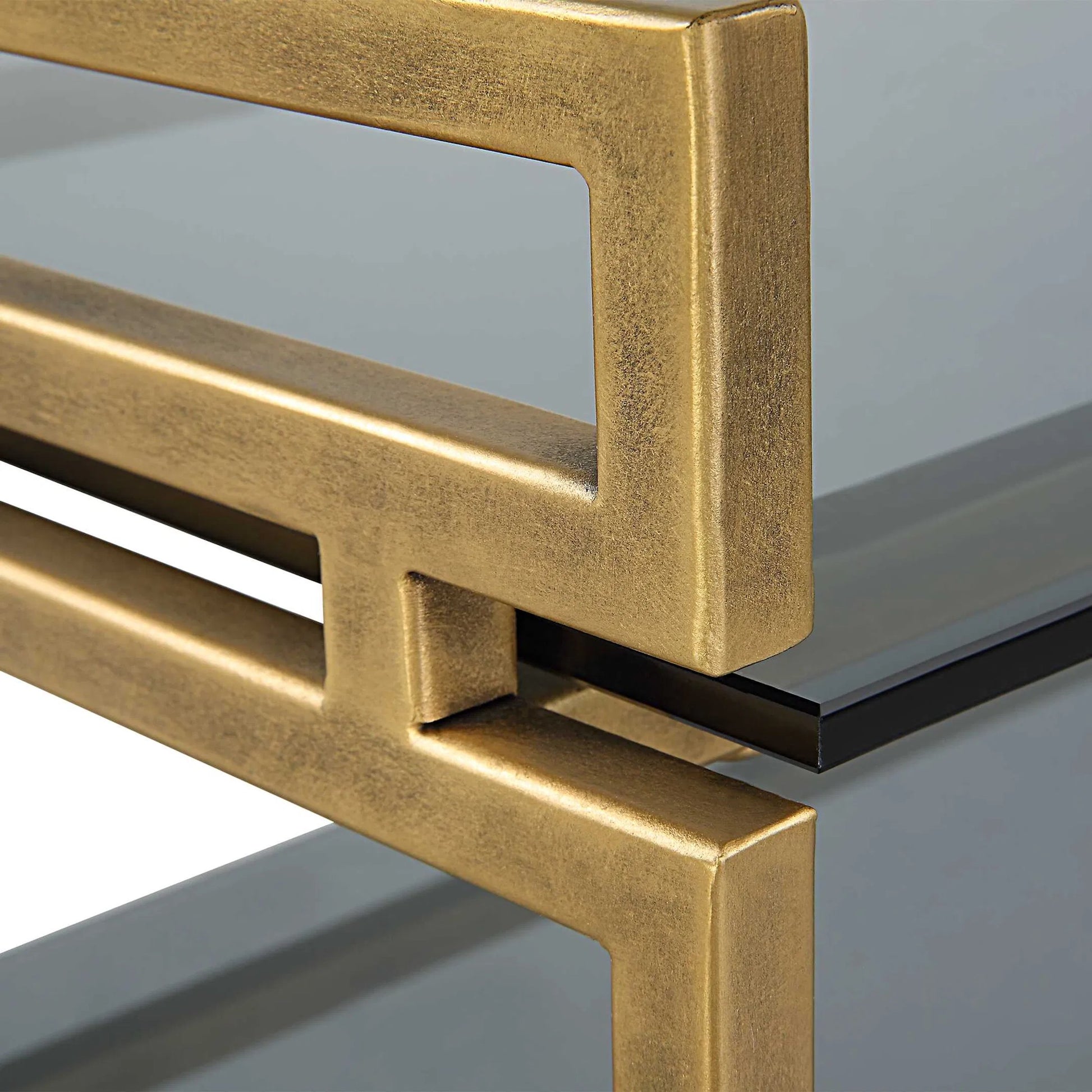 Stacked Up Console Table by Uttermost in antiqued gold. Made from iron, glass in a modern style.
