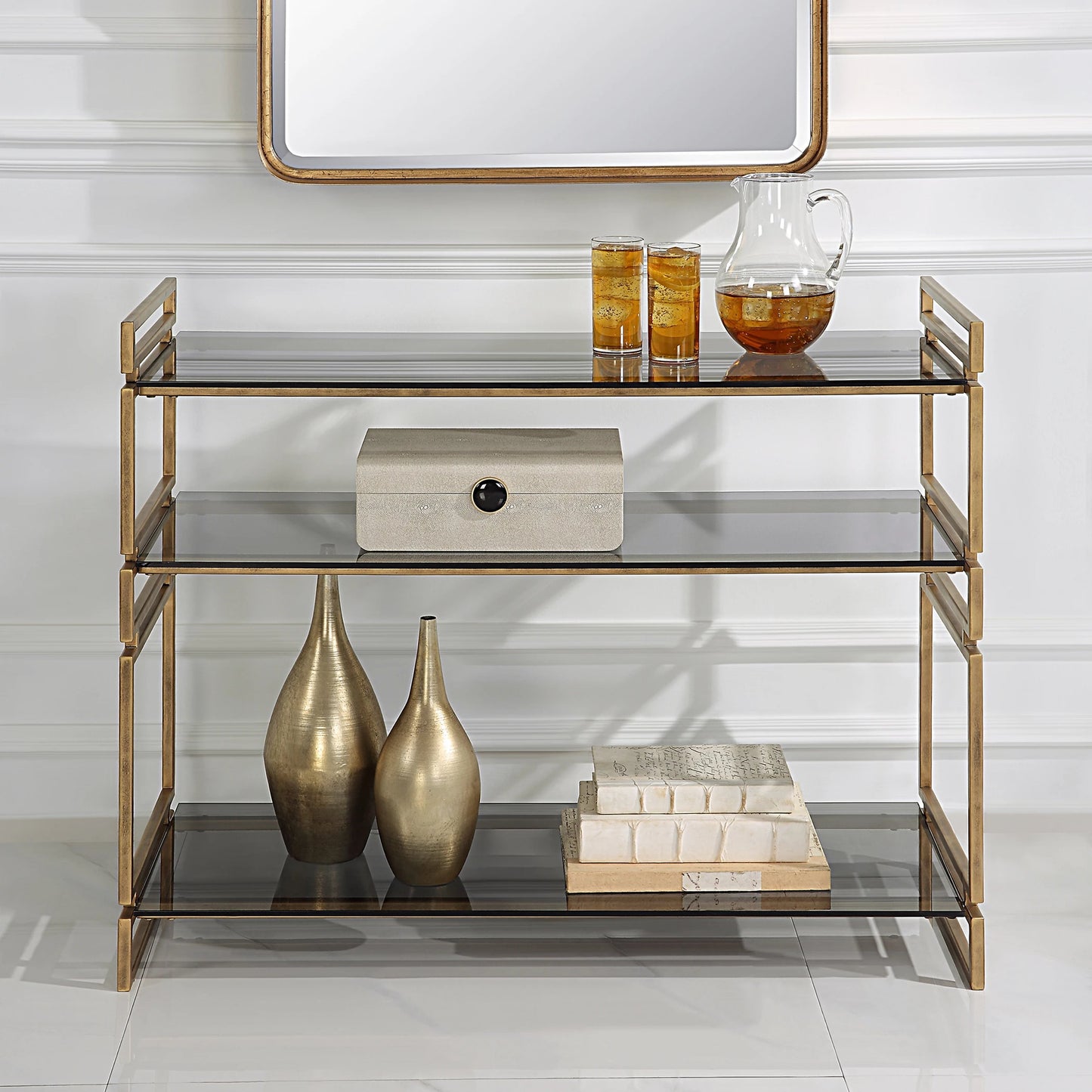 003 SI-2146848 | Lifestyle | Stacked Up Console Table by Uttermost in antiqued gold. Made from iron, glass in a modern style.