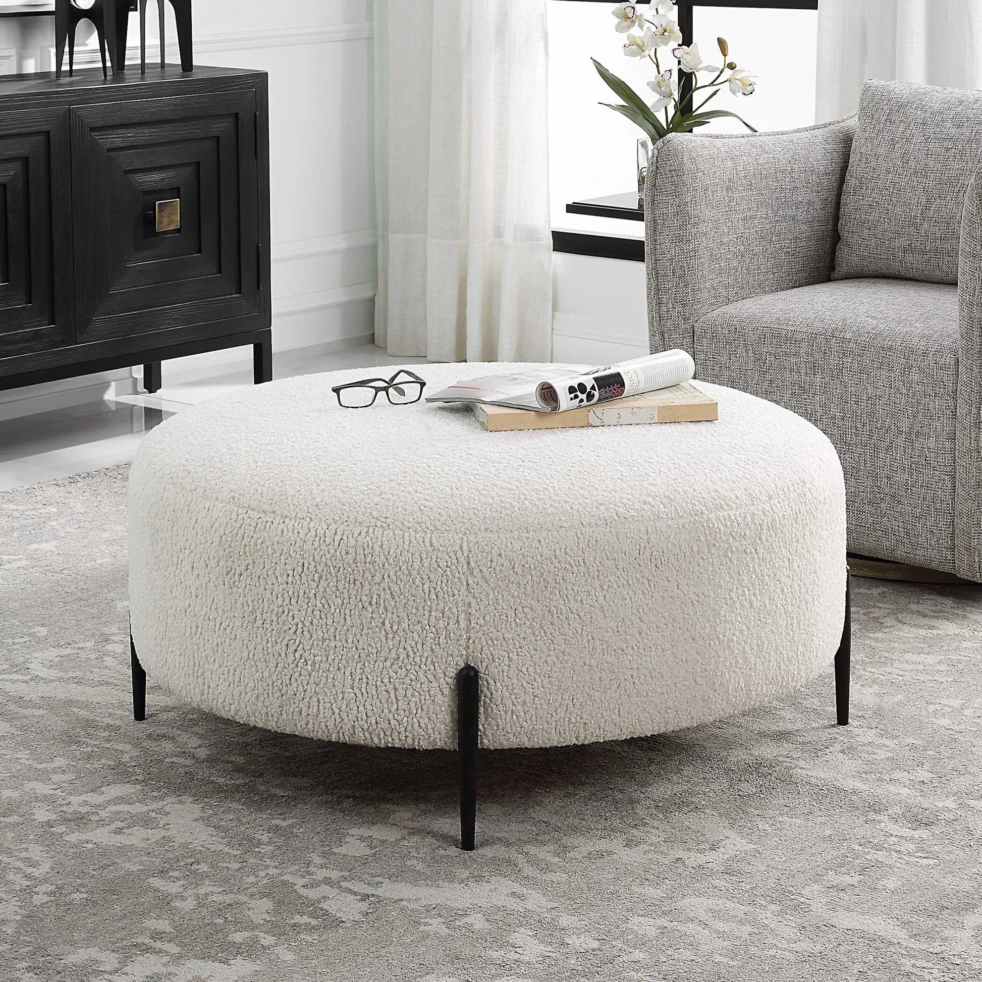 Arles Plush Ottoman by Uttermost in white and satin black. Made from hardwood, metal, plywood, fabric, foam in a modern style.