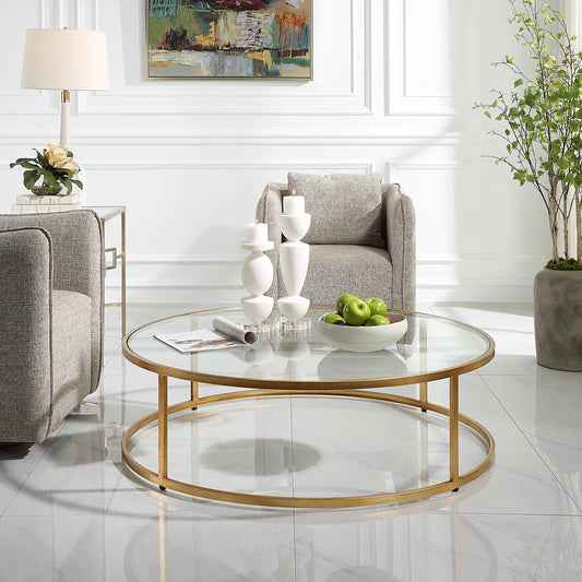 Radius Coffee Table by Uttermost in gold. Made from metal, glass in a modern style.