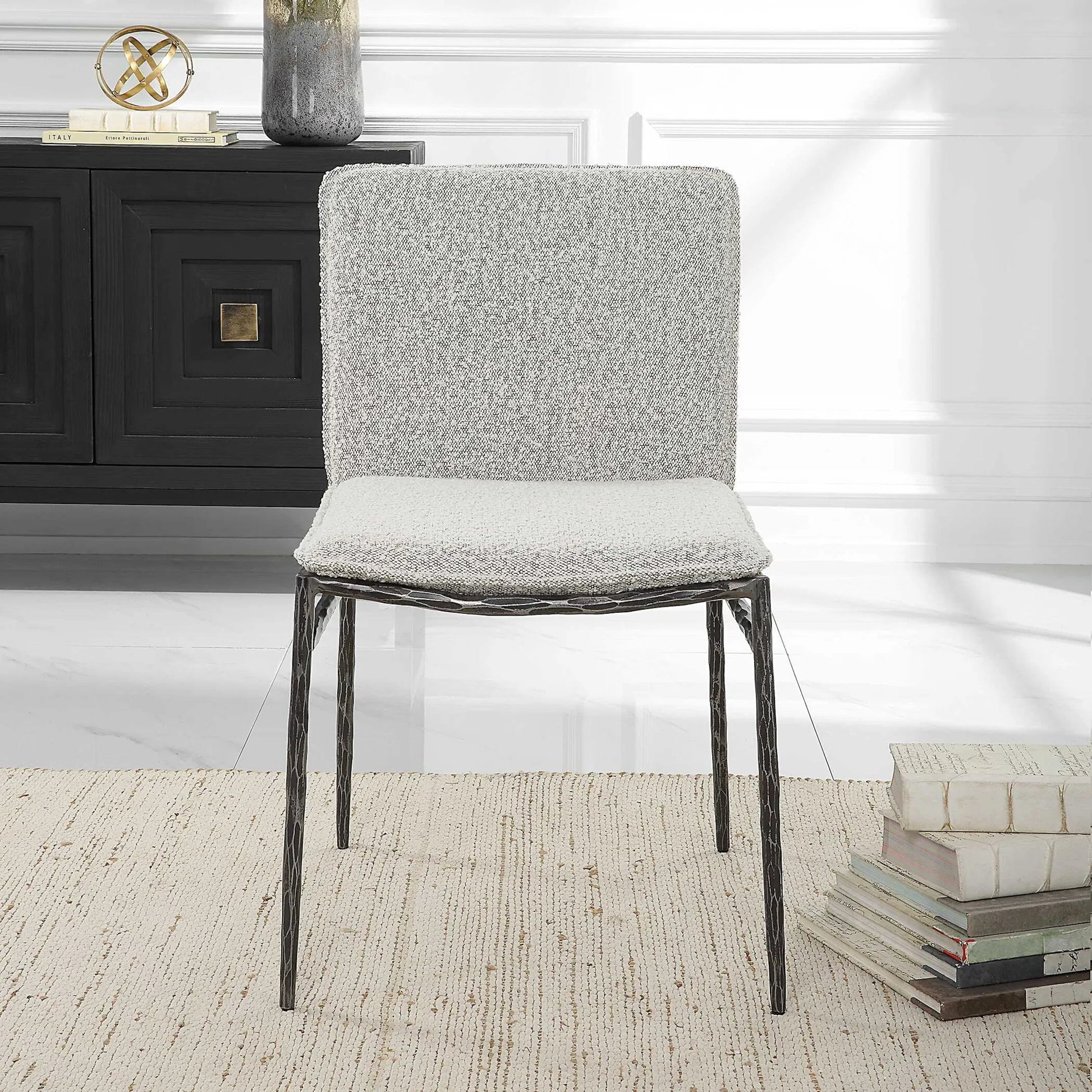 Jacobsen Dining Chair by Uttermost in ivory, warm gray and aged black. Made from iron, fabric, foam, plywood in a modern style.