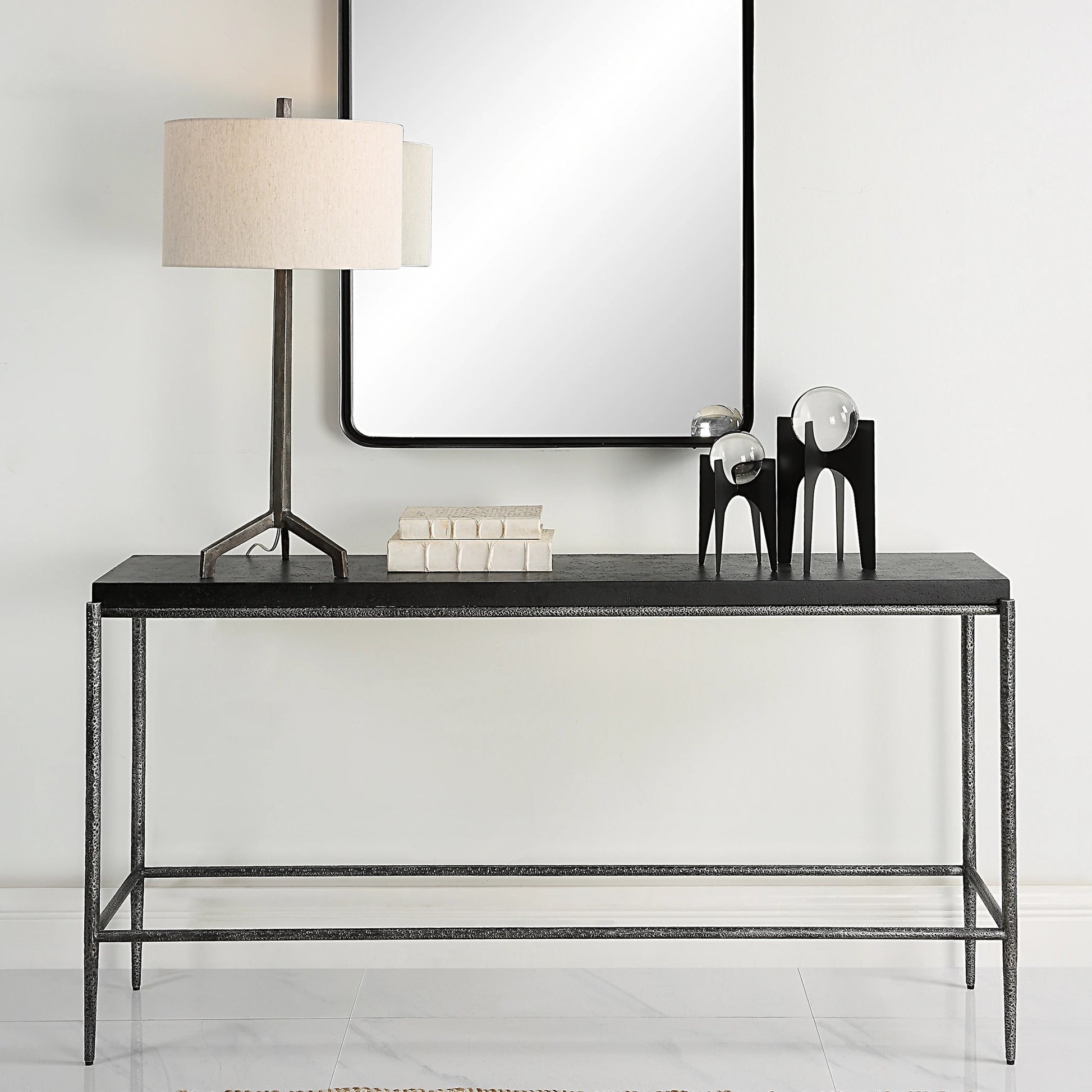 Crescendo Console Table by Uttermost in dark silver. Made from harmmered metal, concrete in a modern style.