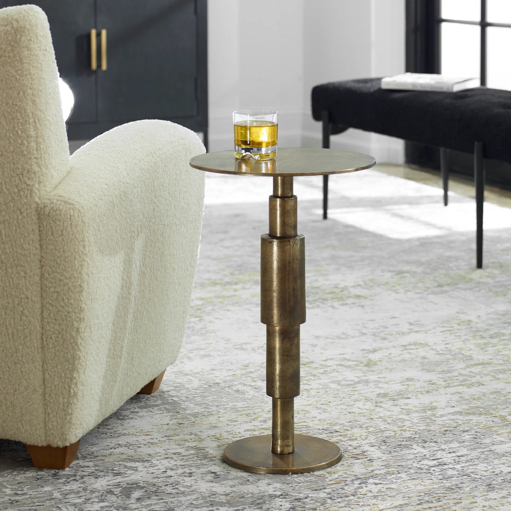 Descend Accent Table by Uttermost in gold. Made from aluminum in a modern style.